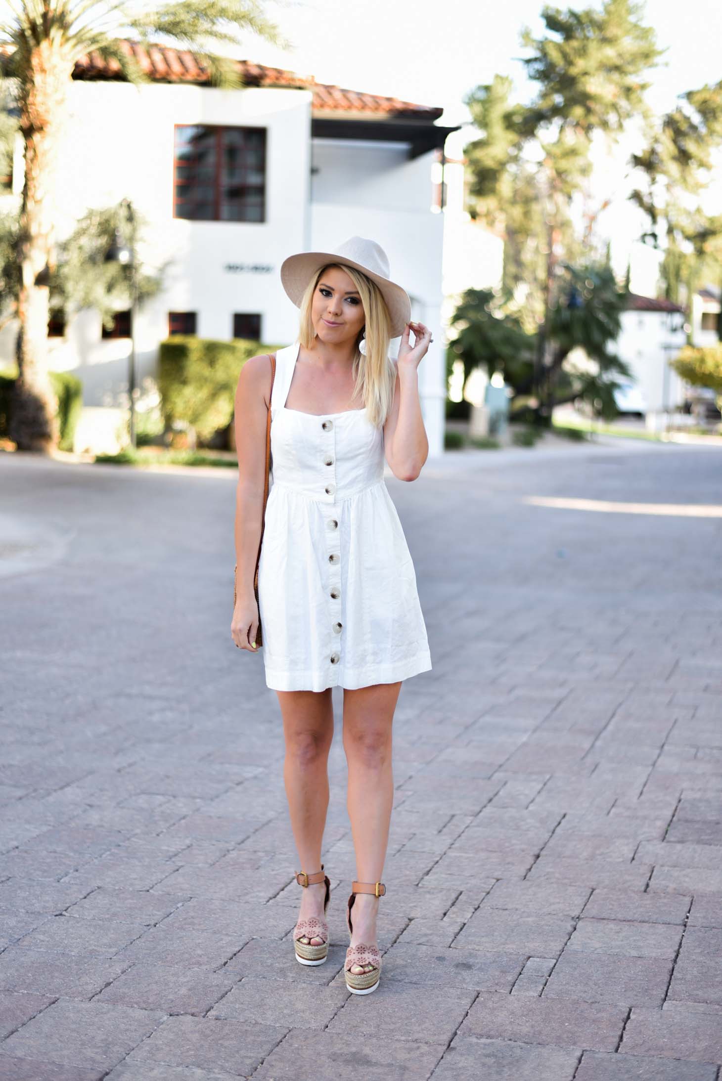 Erin Elizabeth of Wink and a Twirl in Free People White Spring Dress