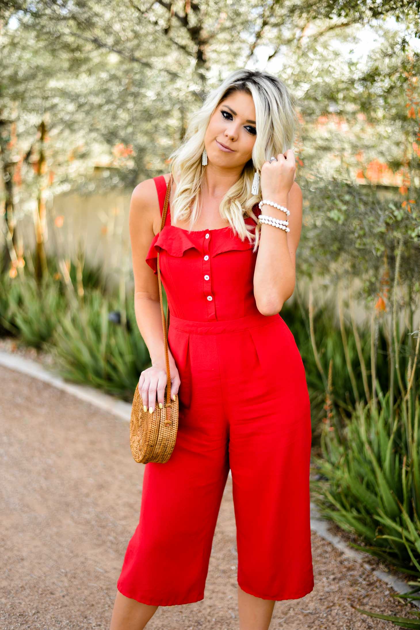 Erin Elizabeth of Wink and a Twirl in Red Jumpsuit Red Dress Boutique