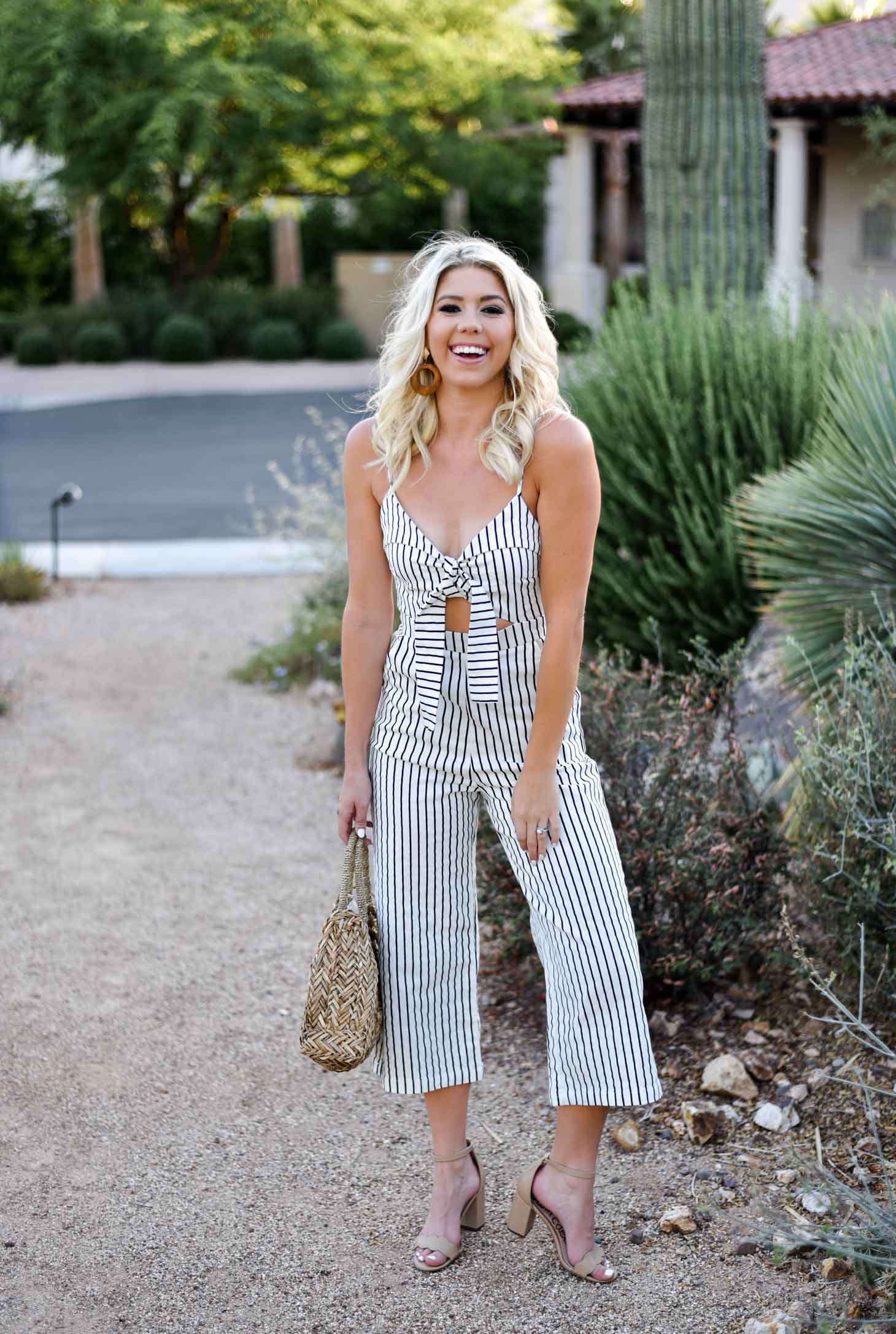 Erin Elizabeth of Wink and a Twirl shares this Mason Jar Boutique Striped Jumpsuit with cutout and tie detail for summer style 