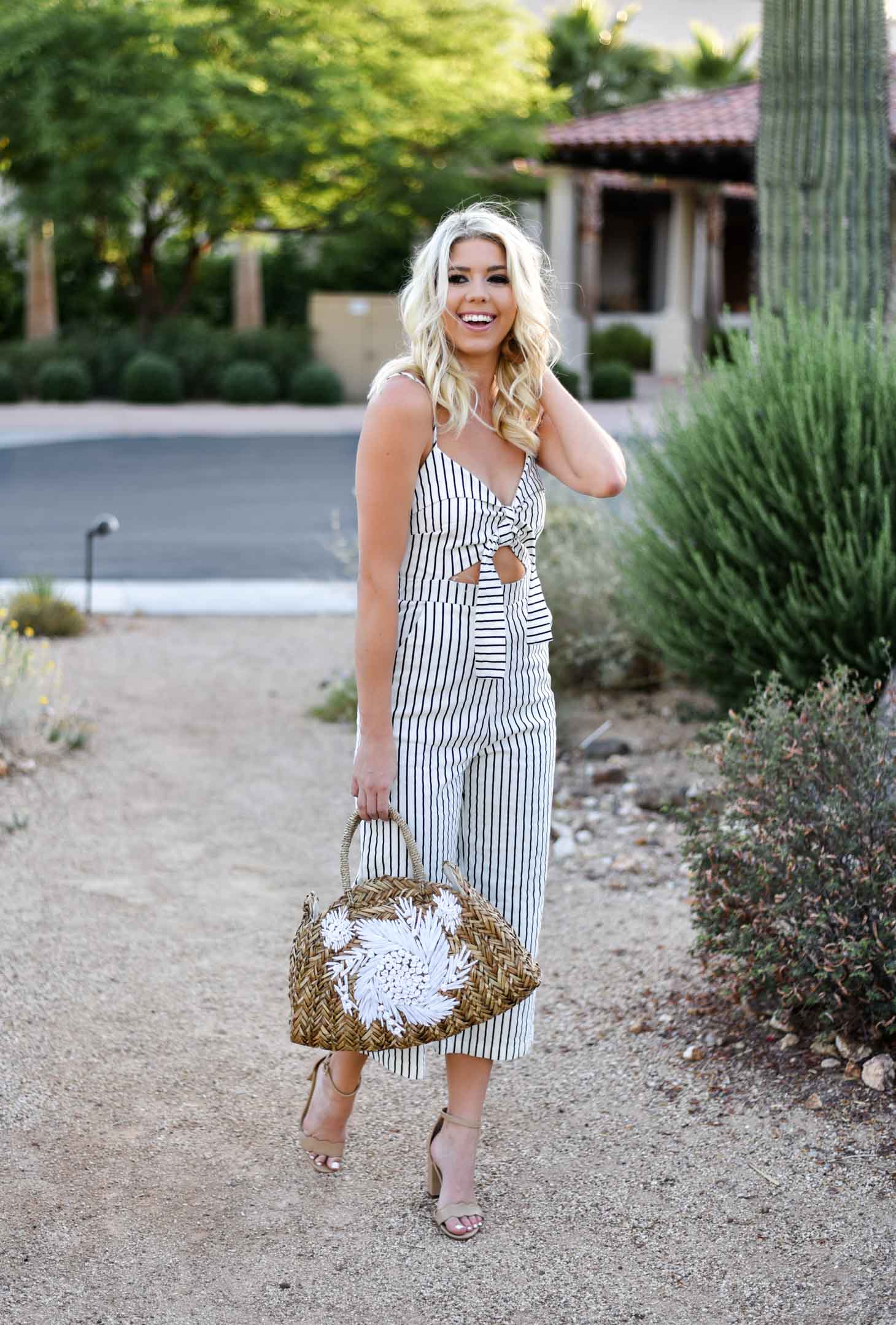 Erin Elizabeth of Wink and a Twirl shares this Mason Jar Boutique Striped Jumpsuit with cutout and tie detail for summer style 