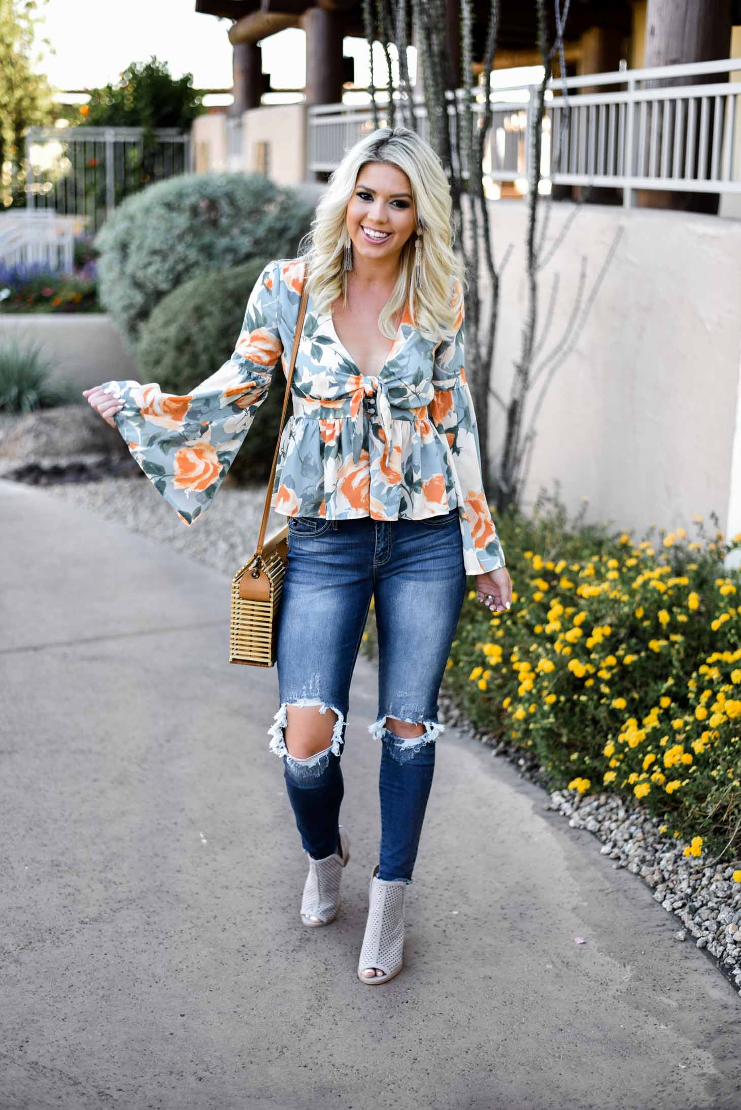 Erin Elizabeth of Wink and a Twirl in this Vici Dolls Jeans and Summer Floral Top