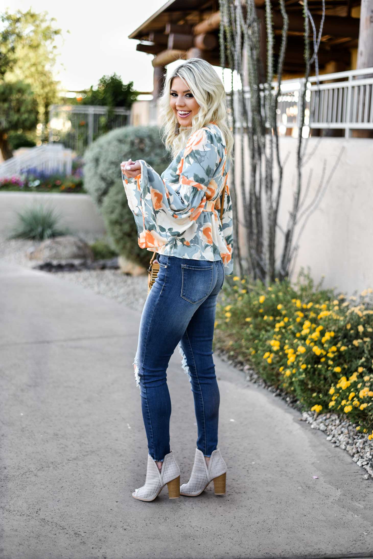 Erin Elizabeth of Wink and a Twirl in this Vici Dolls Jeans and Summer Floral Top