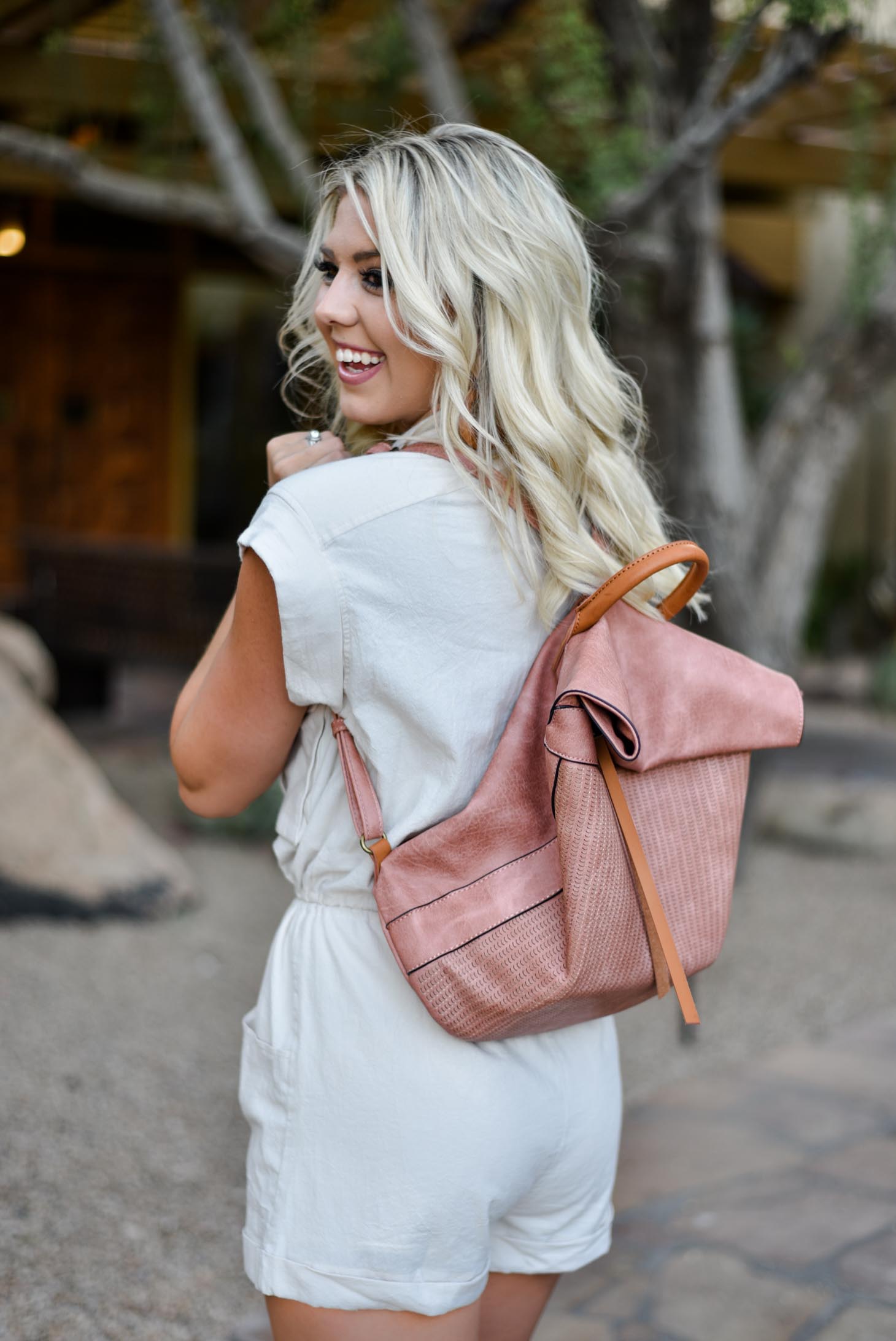 Erin Elizabeth of Wink and a Twirl in this Vici Dolls Tie Romper and Backpack Summer Style