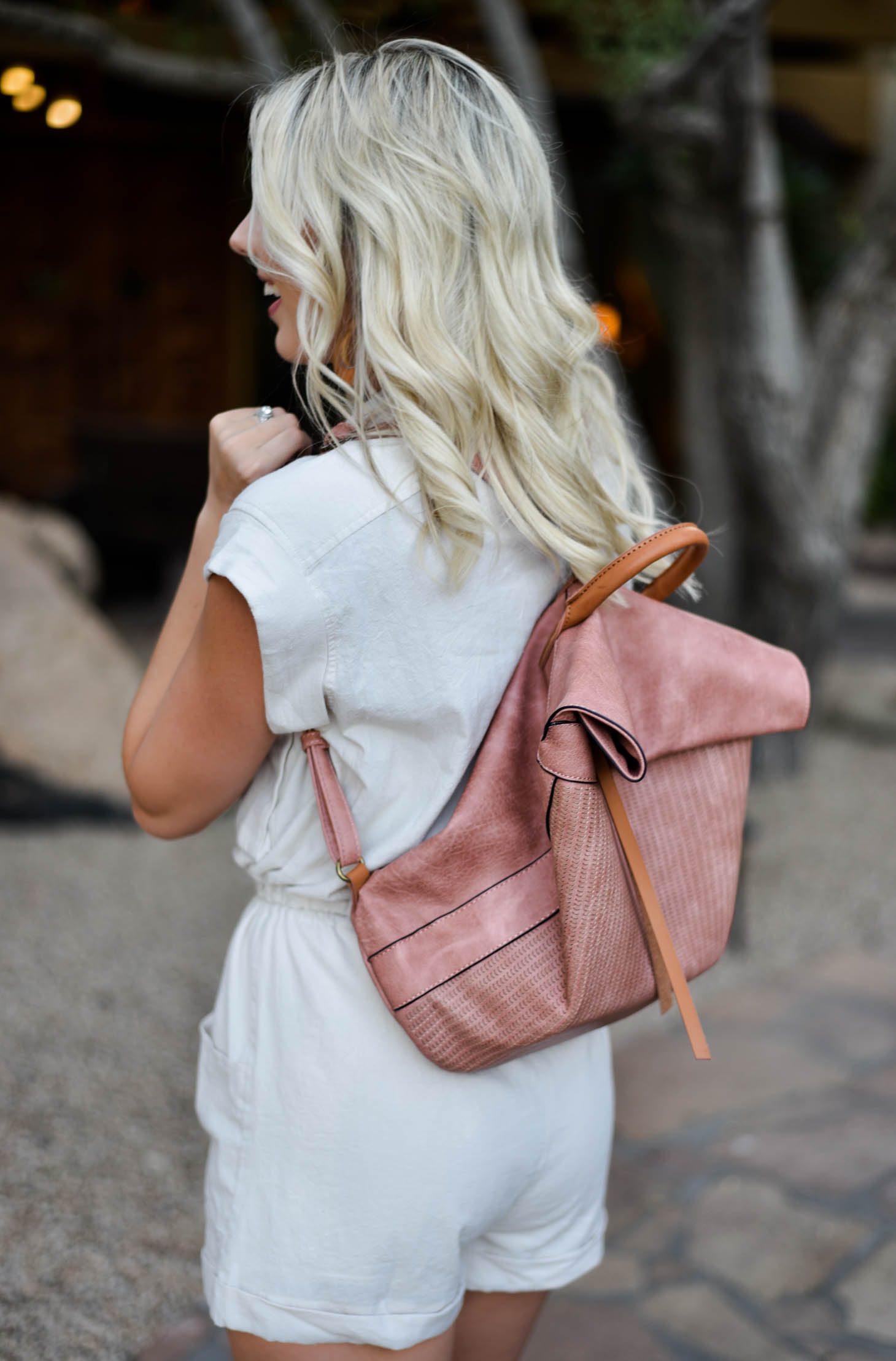 Erin Elizabeth of Wink and a Twirl in this Vici Dolls Tie Romper and Backpack Summer Style