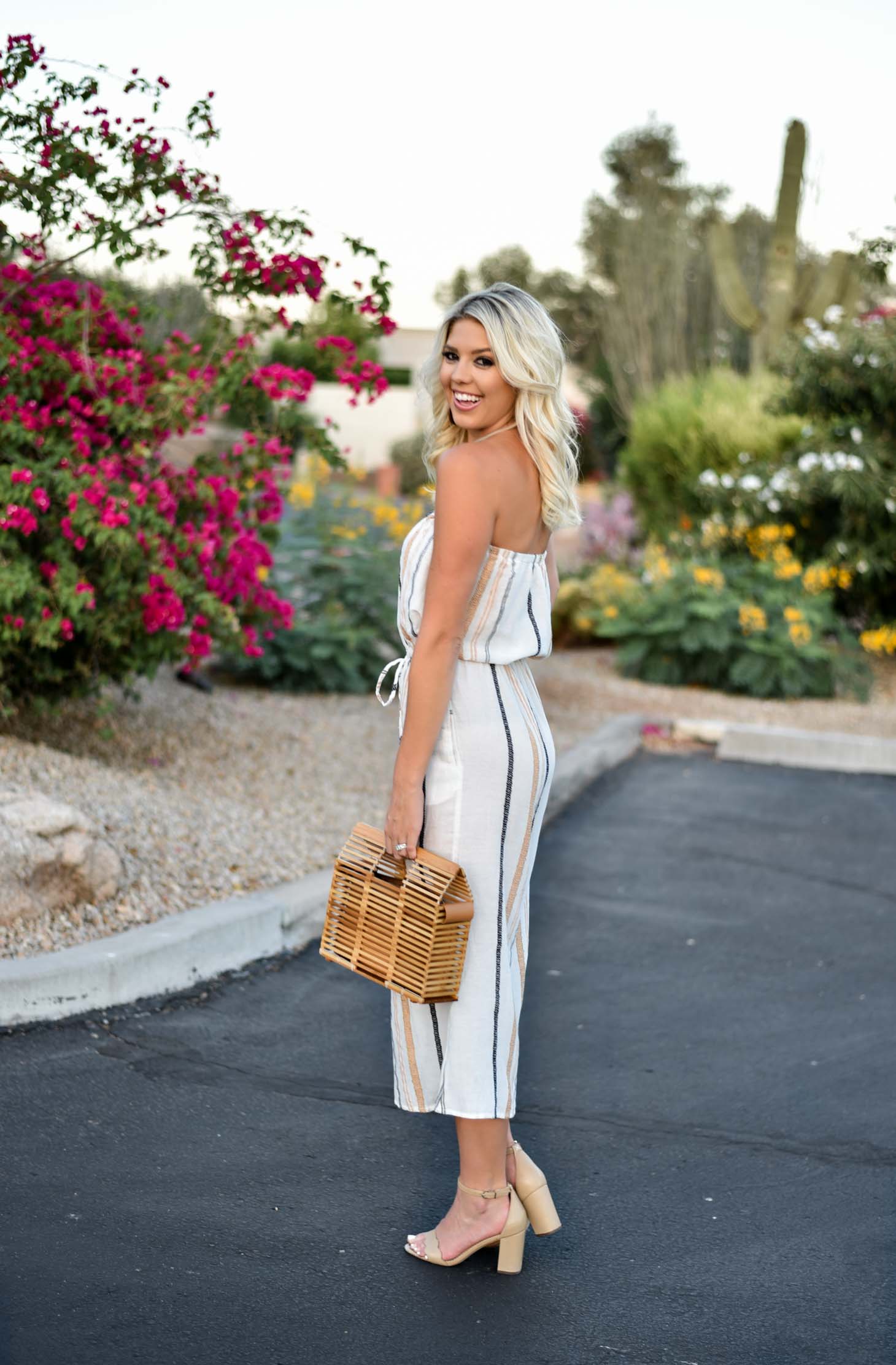 Erin Elizabeth of Wink and a Twirl shares this Vici Dolls striped jumpsuit and bamboo bag perfect for summer