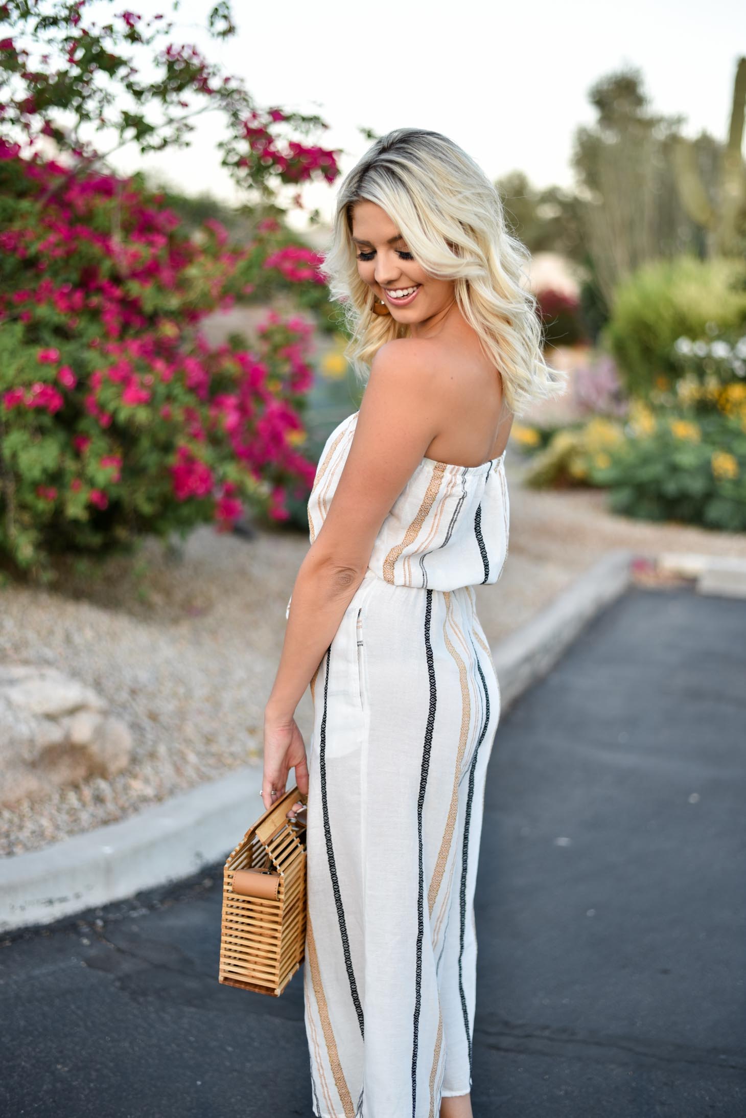 Erin Elizabeth of Wink and a Twirl shares this Vici Dolls striped jumpsuit and bamboo bag perfect for summer
