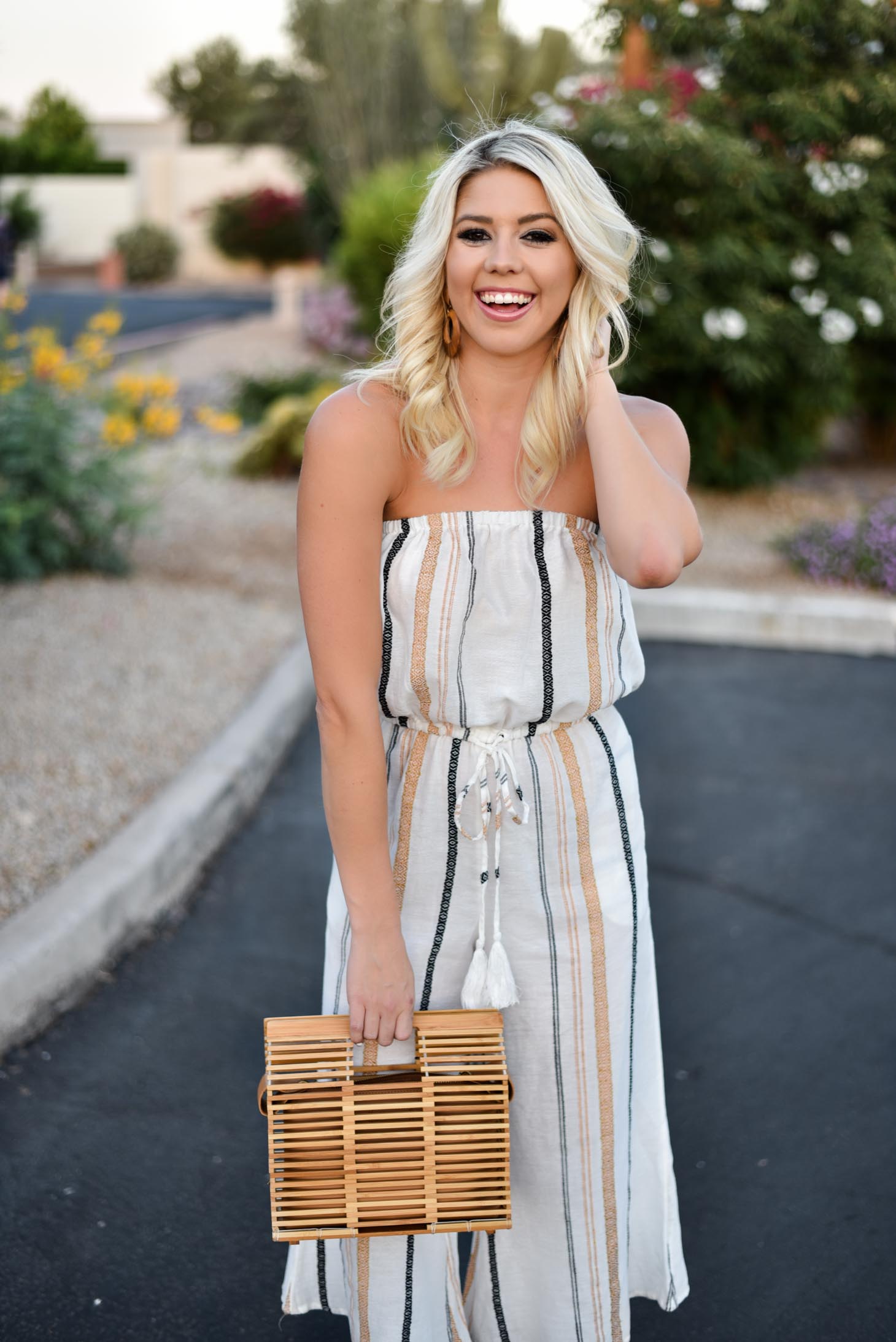 Erin Elizabeth of Wink and a Twirl shares this Vici Dolls striped jumpsuit and bamboo bag perfect for summer