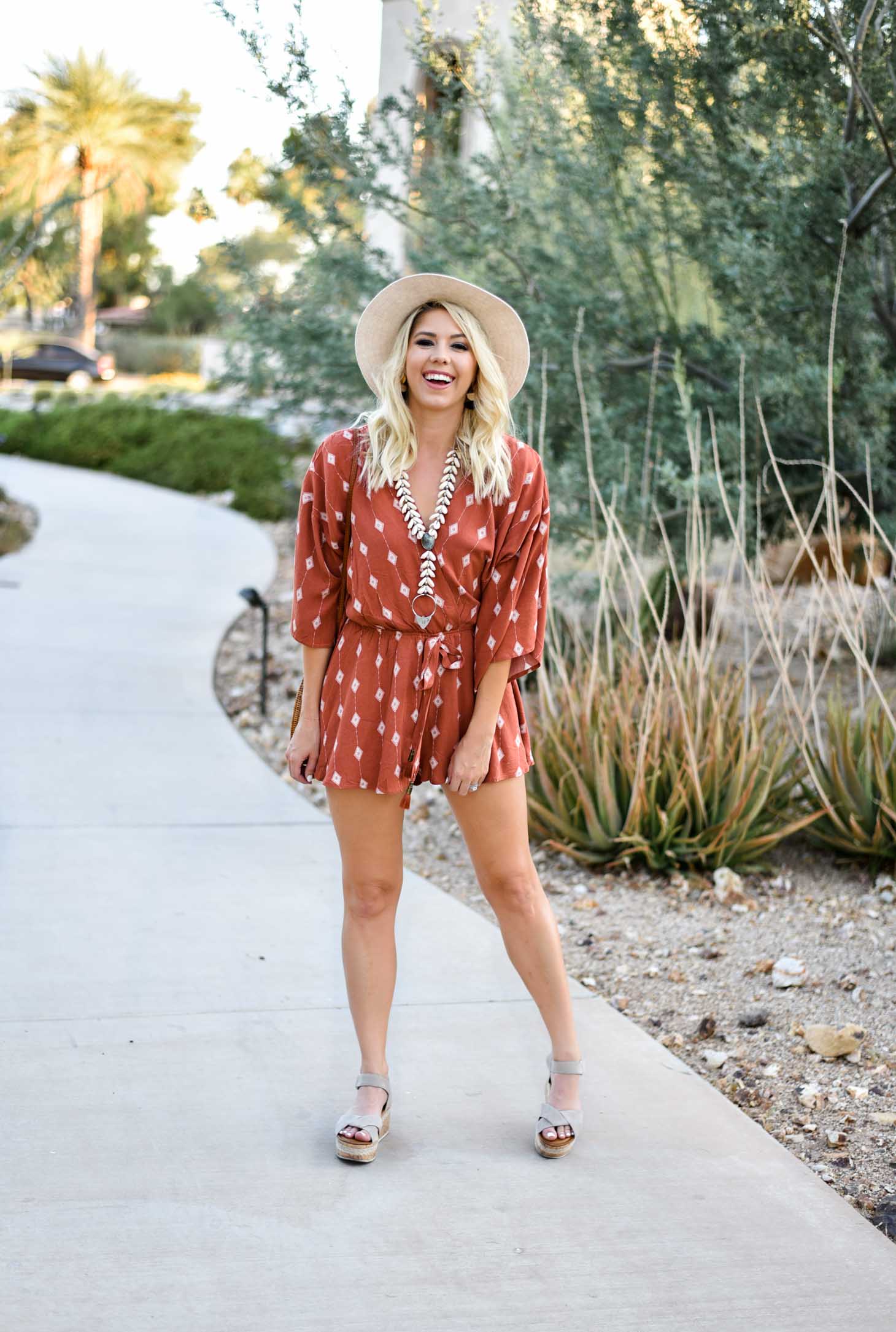 Erin Elizabeth of Wink and a Twirl I'm this summer romper from Red Dress Boutique