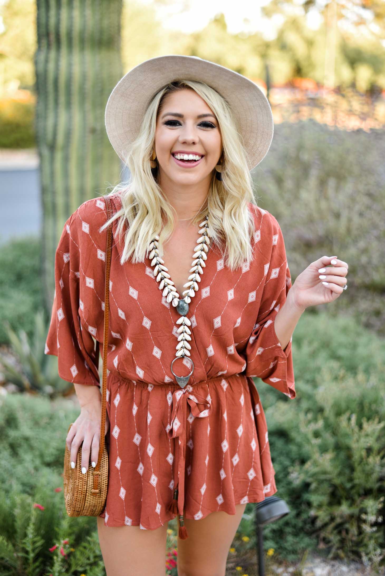 Erin Elizabeth of Wink and a Twirl I'm this summer romper from Red Dress Boutique