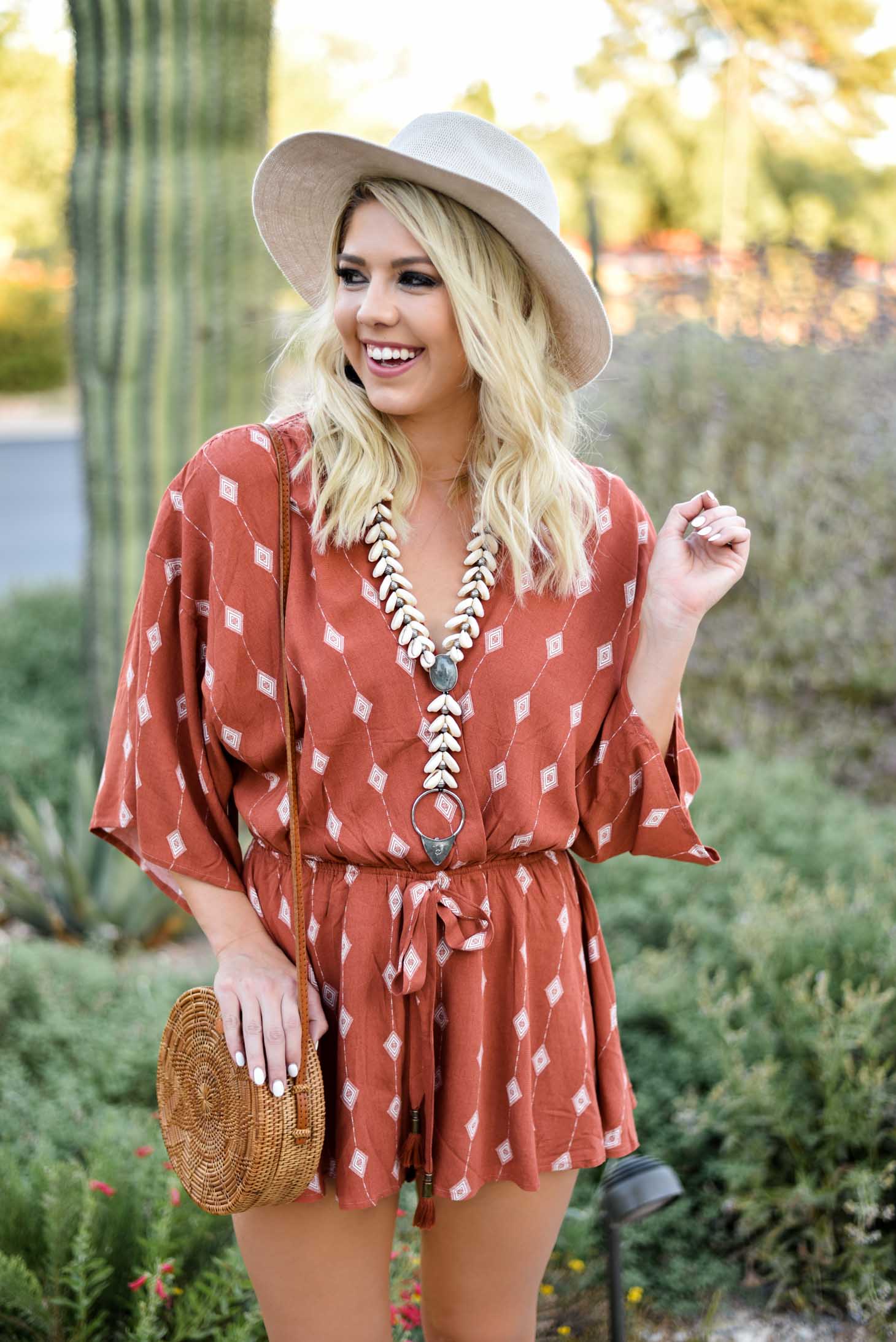 Erin Elizabeth of Wink and a Twirl I'm this summer romper from Red Dress Boutique