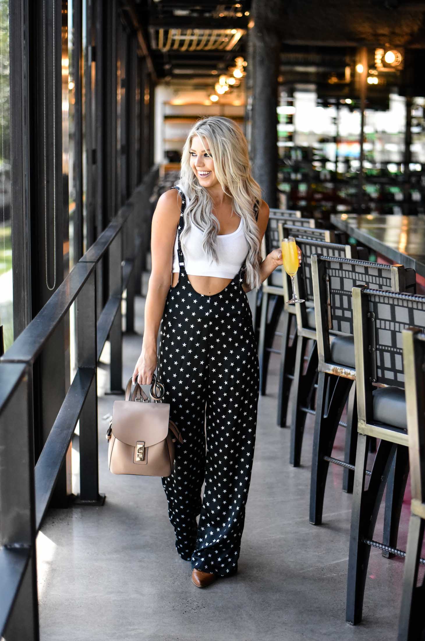 Erin Elizabeth of Wink and a Twirl in these star print pants and white tank perfect for your summer style 