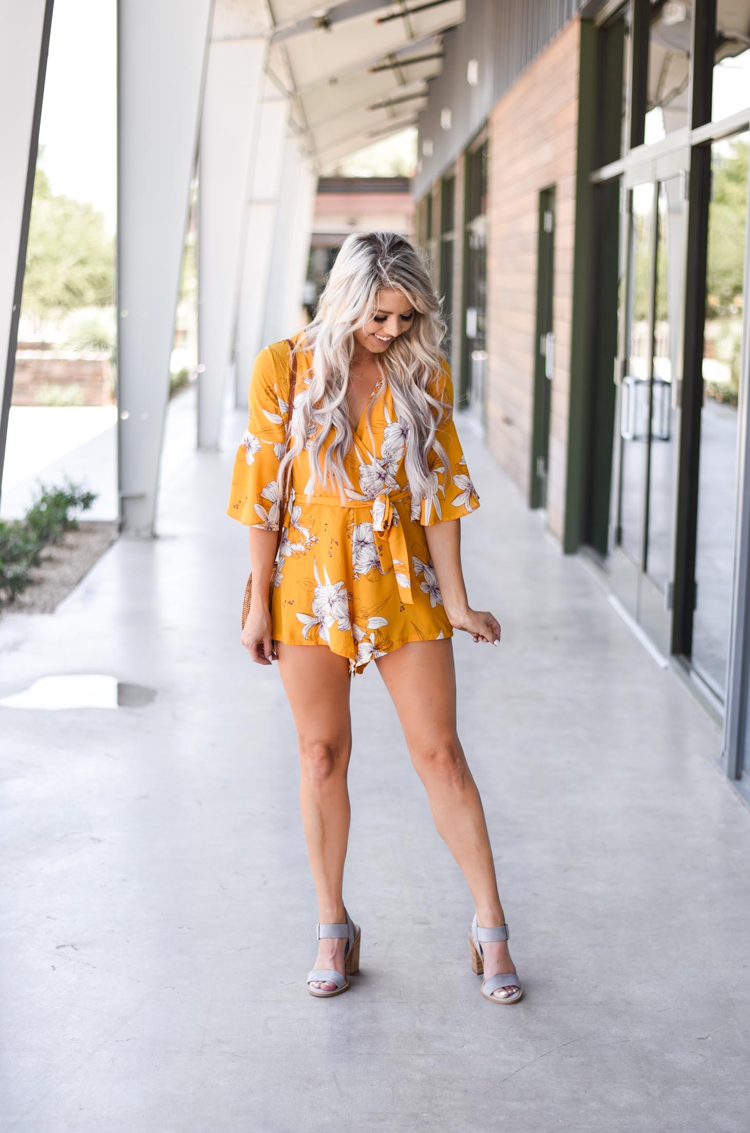 Erin Elizabeth of Wink and a Twirl shares this cute yellow romper from Chicwish perfect for Summer and Fall style