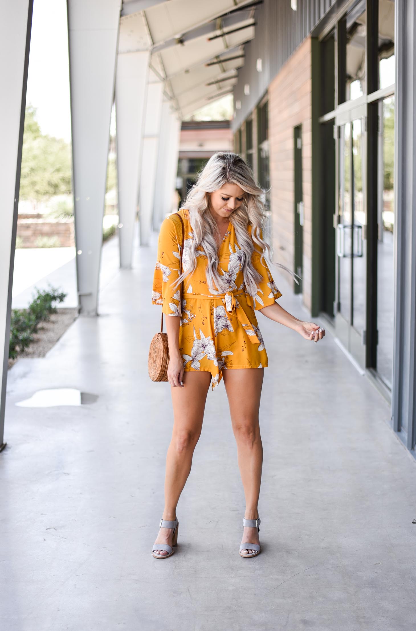 Erin Elizabeth of Wink and a Twirl shares this cute yellow romper from Chicwish perfect for Summer and Fall style