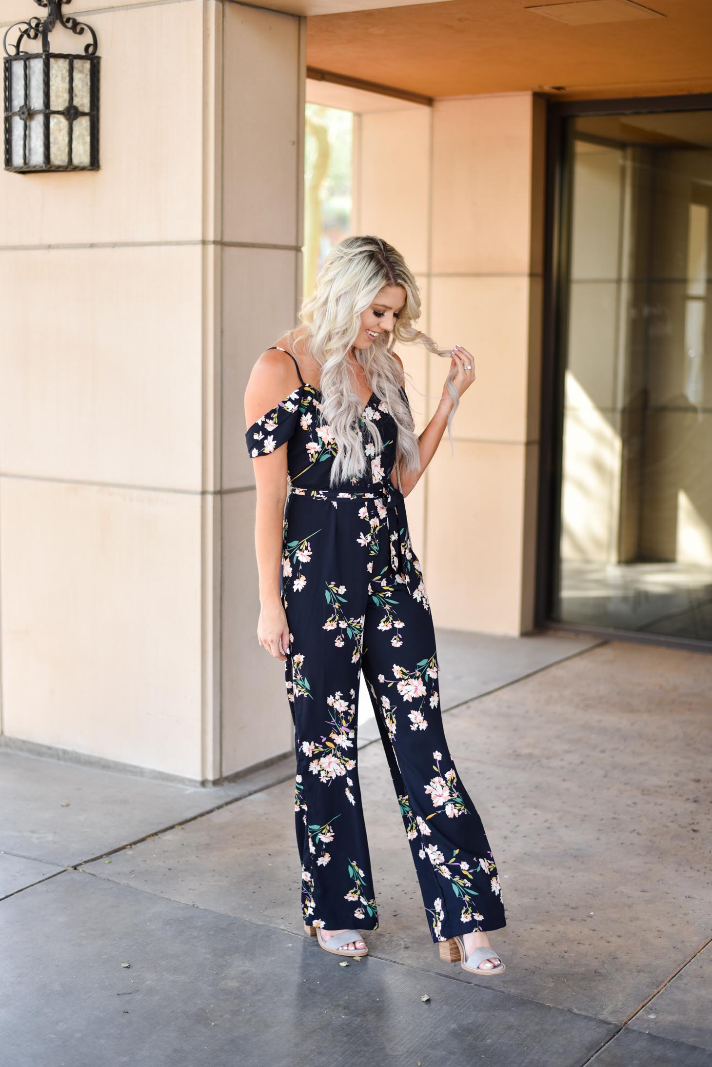 Erin Elizabeth of Wink and a Twirl in this Shop Sugar Lips floral jumpsuit