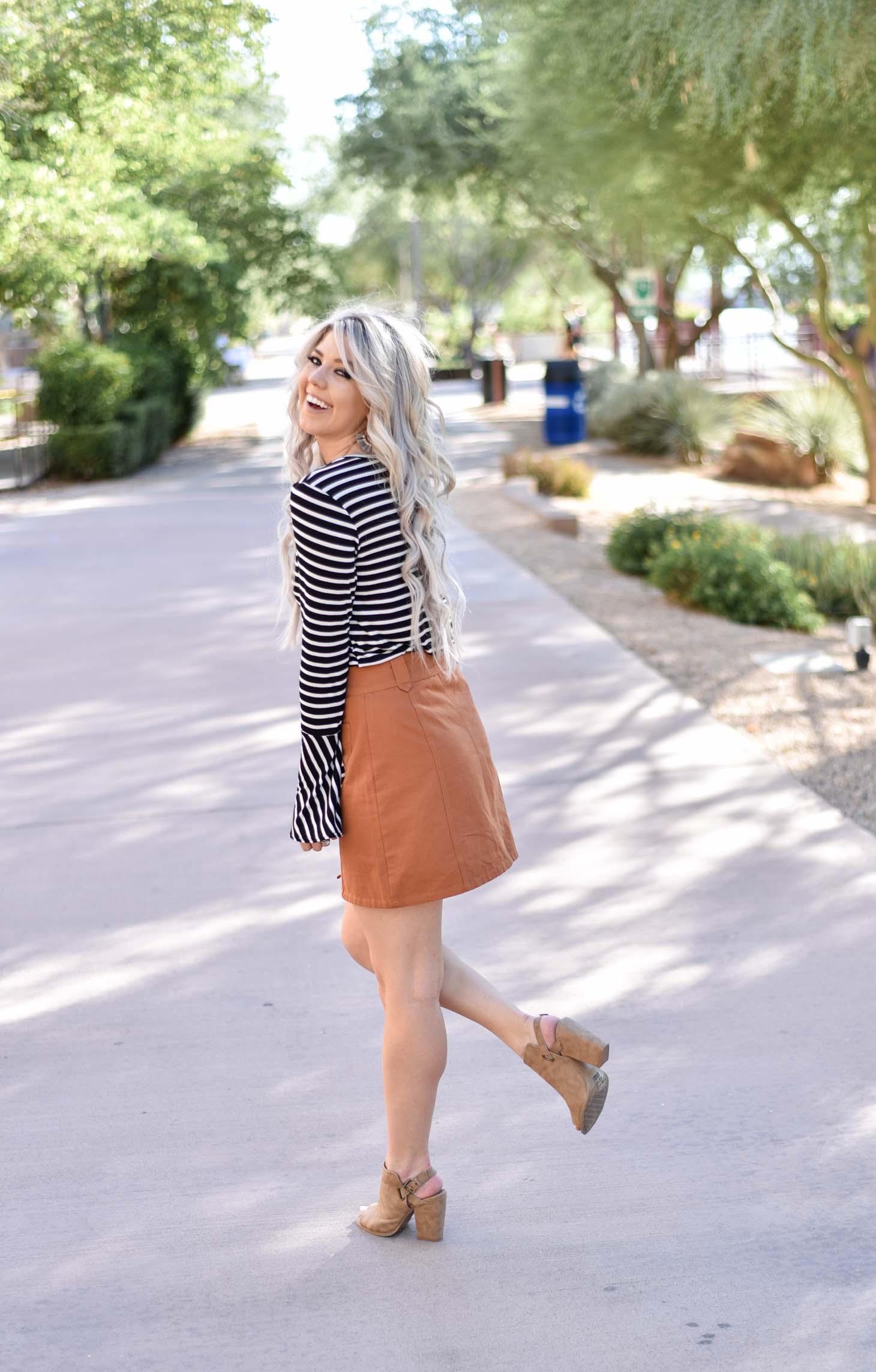 Erin Elizabeth of Wink and a Twirl shares two ways to style a striped top from Pink Lily Boutique perfect for your fall style this year