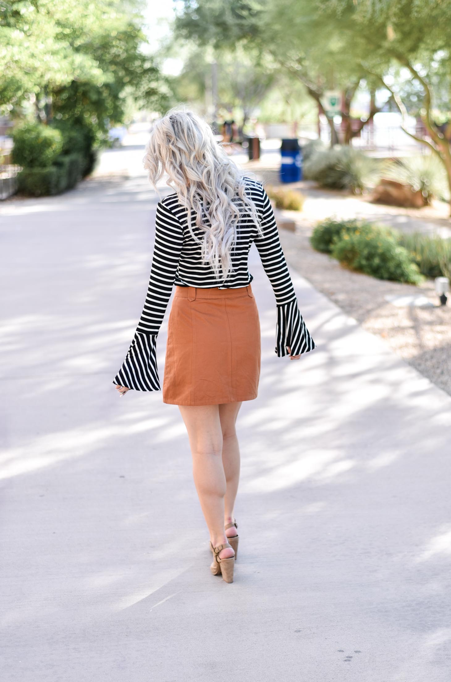 Erin Elizabeth of Wink and a Twirl shares two ways to style a striped top from Pink Lily Boutique perfect for your fall style this year