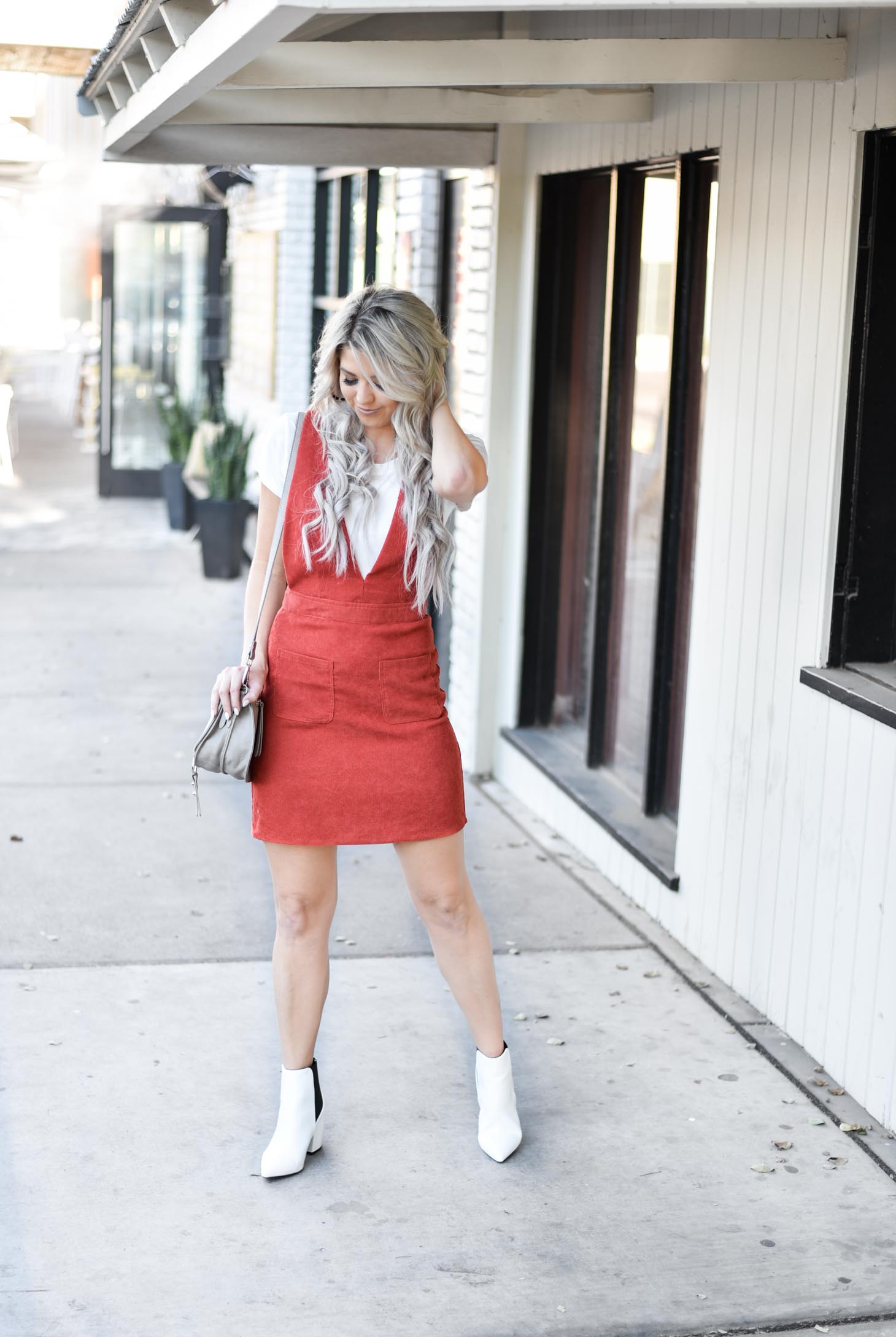 Erin Elizabeth of Wink and a Twirl share the cutest fall look with Red Dress Boutique Fall Jumper and White Booties