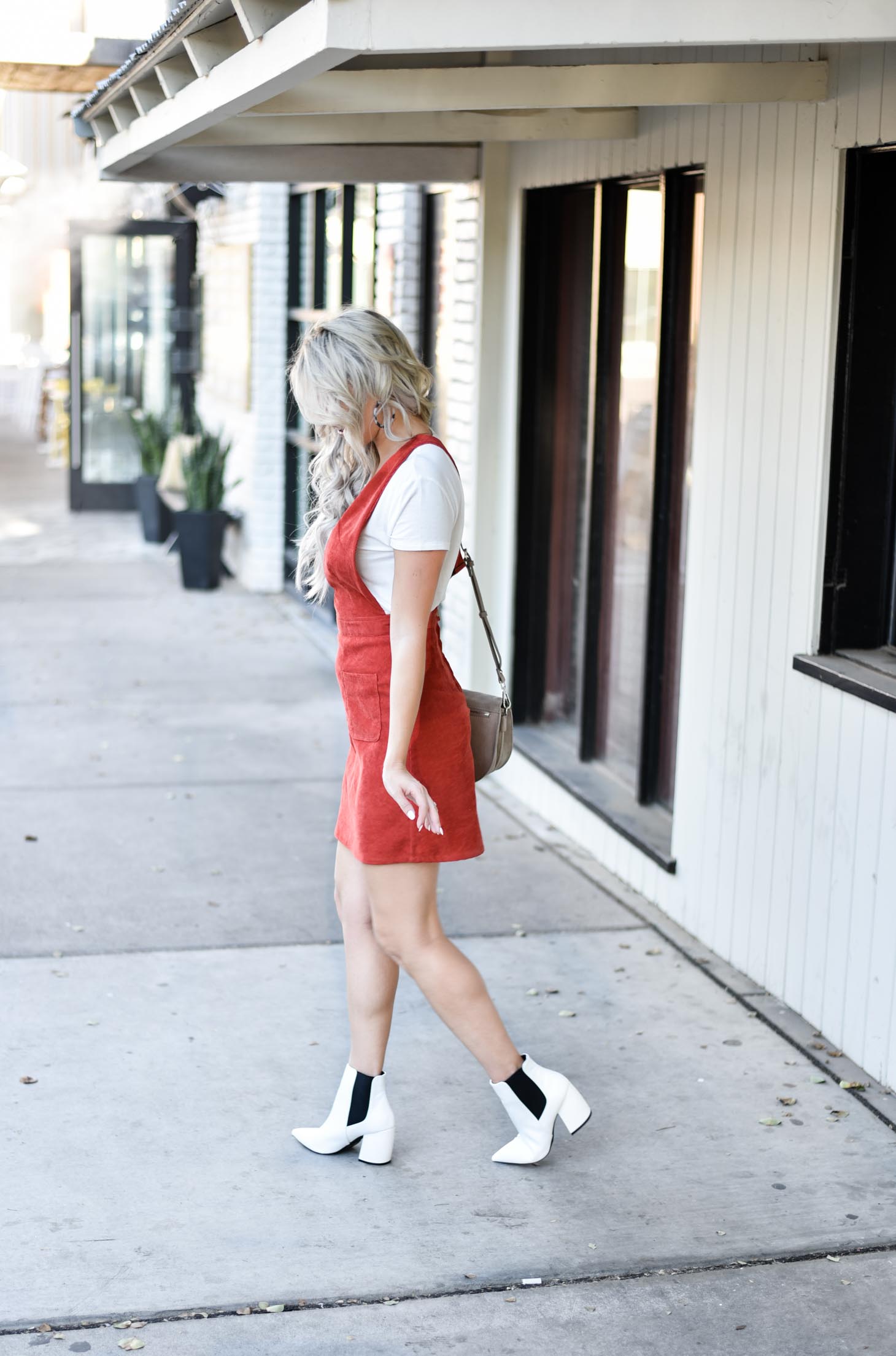 Erin Elizabeth of Wink and a Twirl share the cutest fall look with Red Dress Boutique Fall Jumper and White Booties