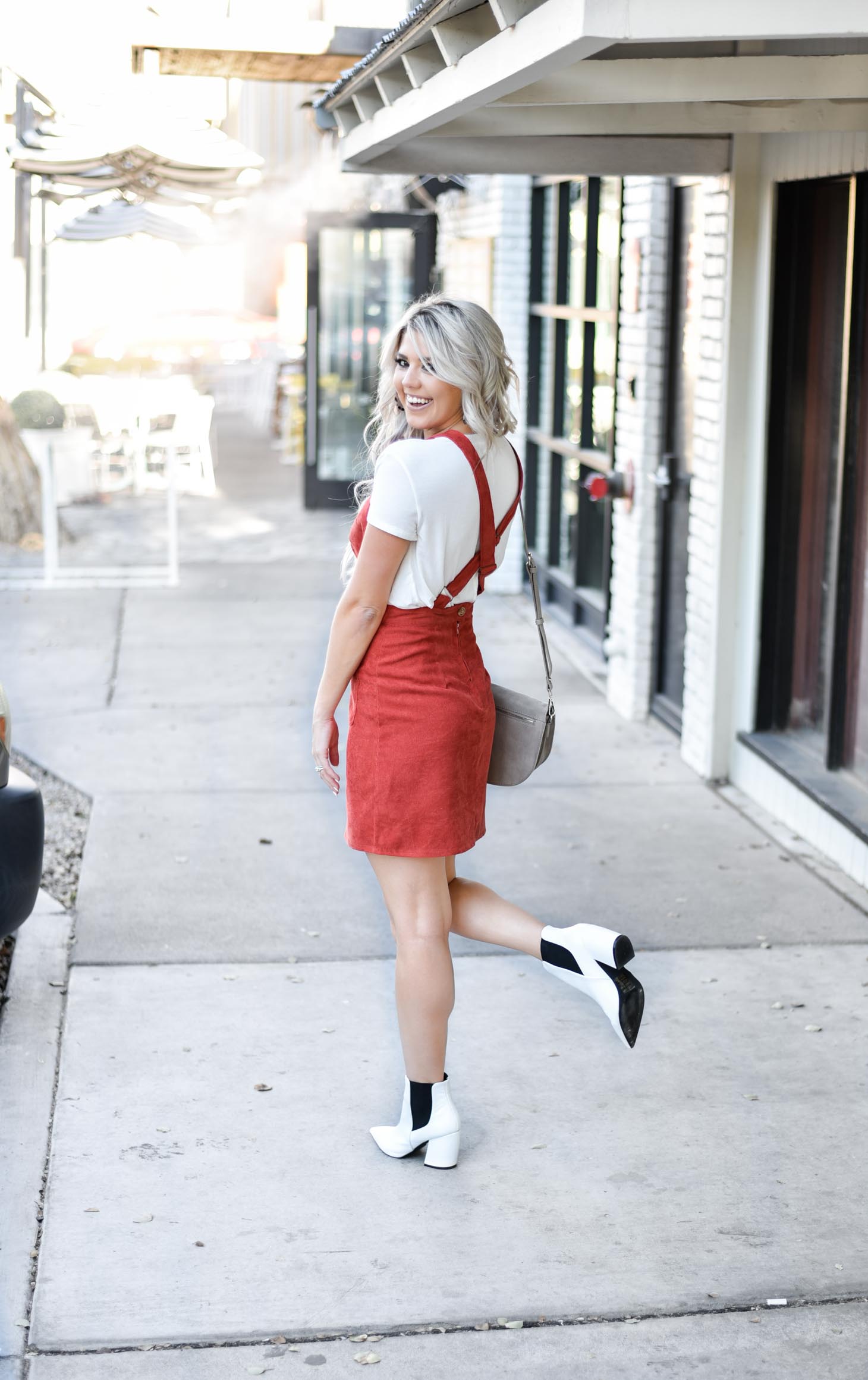 Erin Elizabeth of Wink and a Twirl share the cutest fall look with Red Dress Boutique Fall Jumper and White Booties