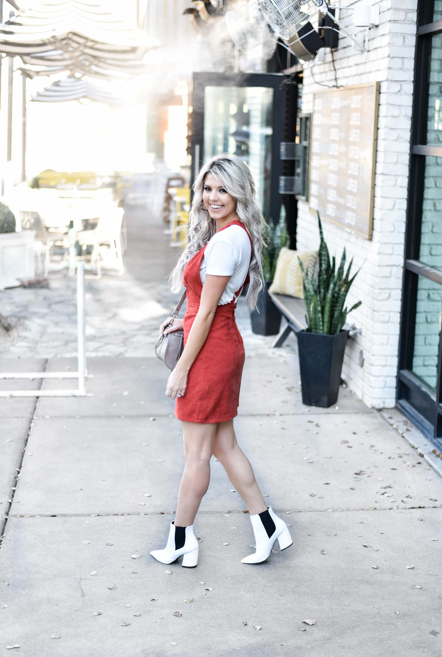 Erin Elizabeth of Wink and a Twirl share the cutest fall look with Red Dress Boutique Fall Jumper and White Booties