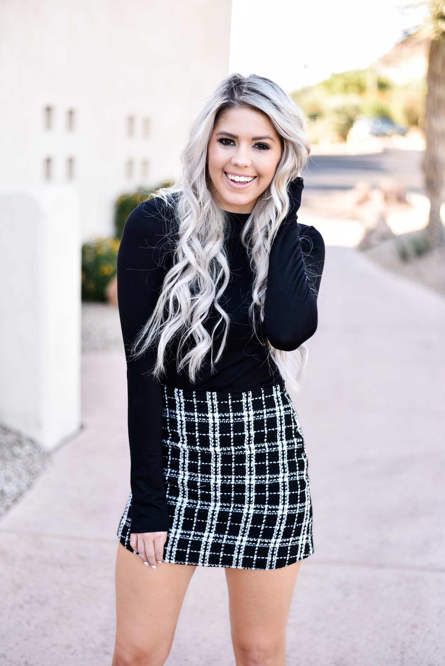 Erin Elizabeth of Wink and a Twirl share two ways to style a black long sleeve top from Pink Lily Boutique