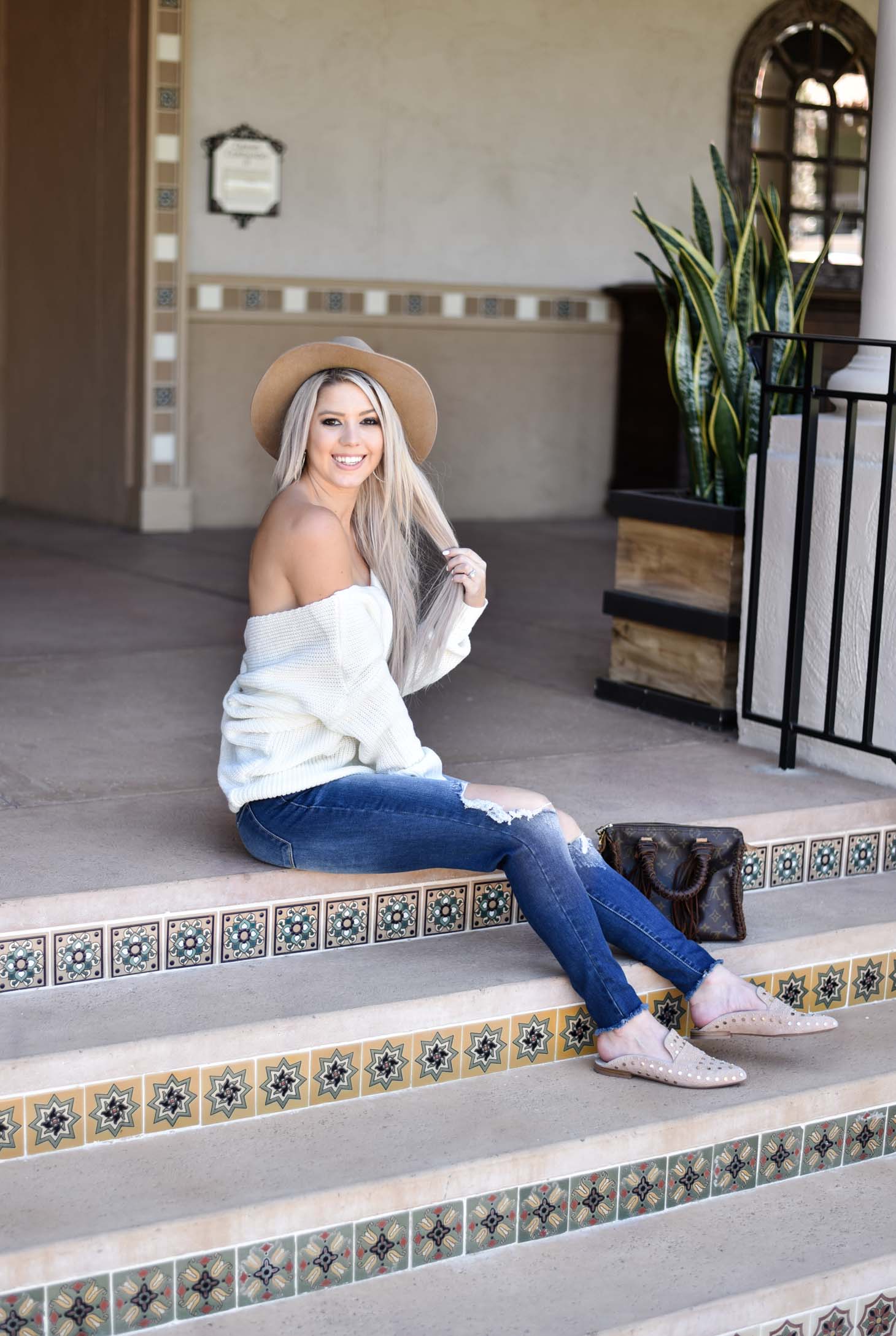 Erin Elizabeth of Wink and a Twirl shares the cutest off the shoulder sweater from Chicwish