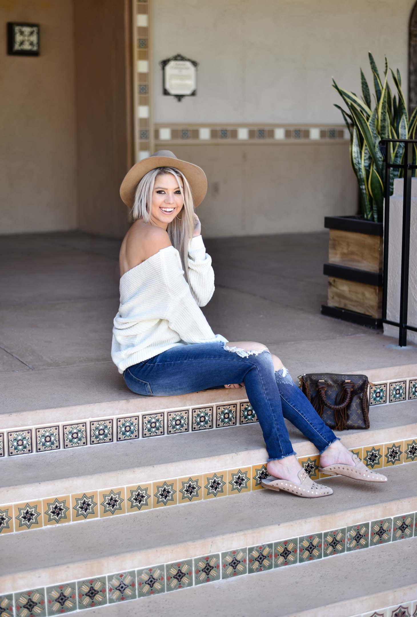 Erin Elizabeth of Wink and a Twirl shares the cutest off the shoulder sweater from Chicwish