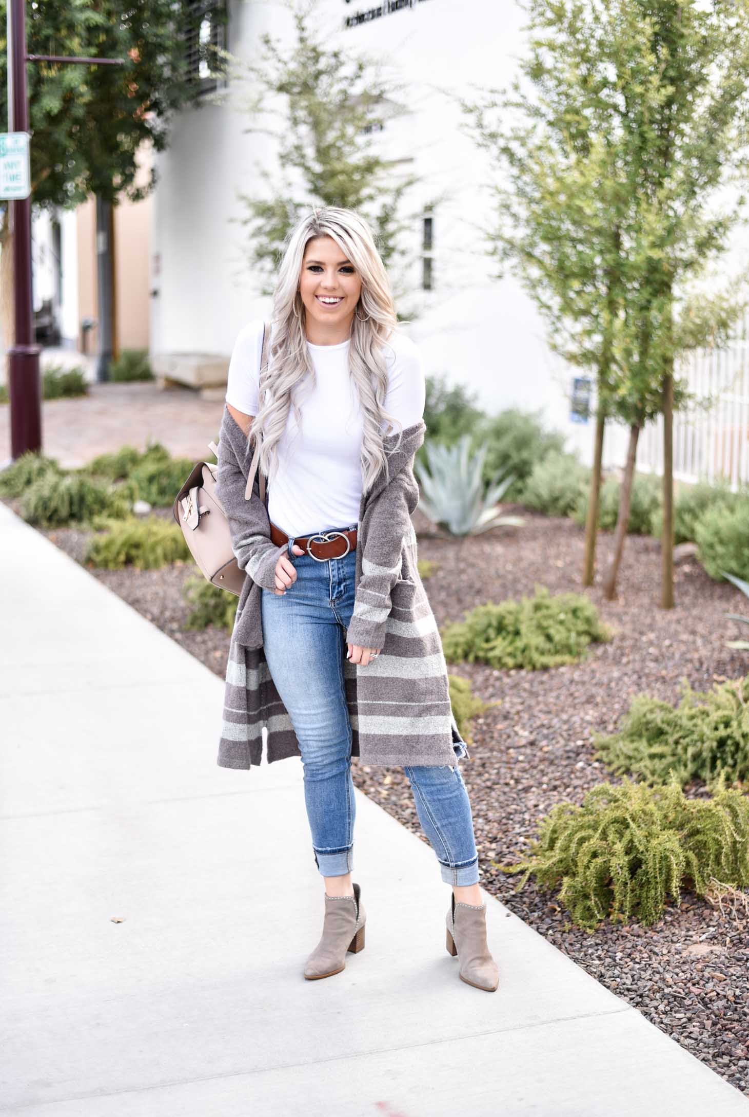 Erin Elizabeth of Wink and a Twirl share the cutest brown and white striped cardigan from Shop Sweet Olive perfect for layering this fall