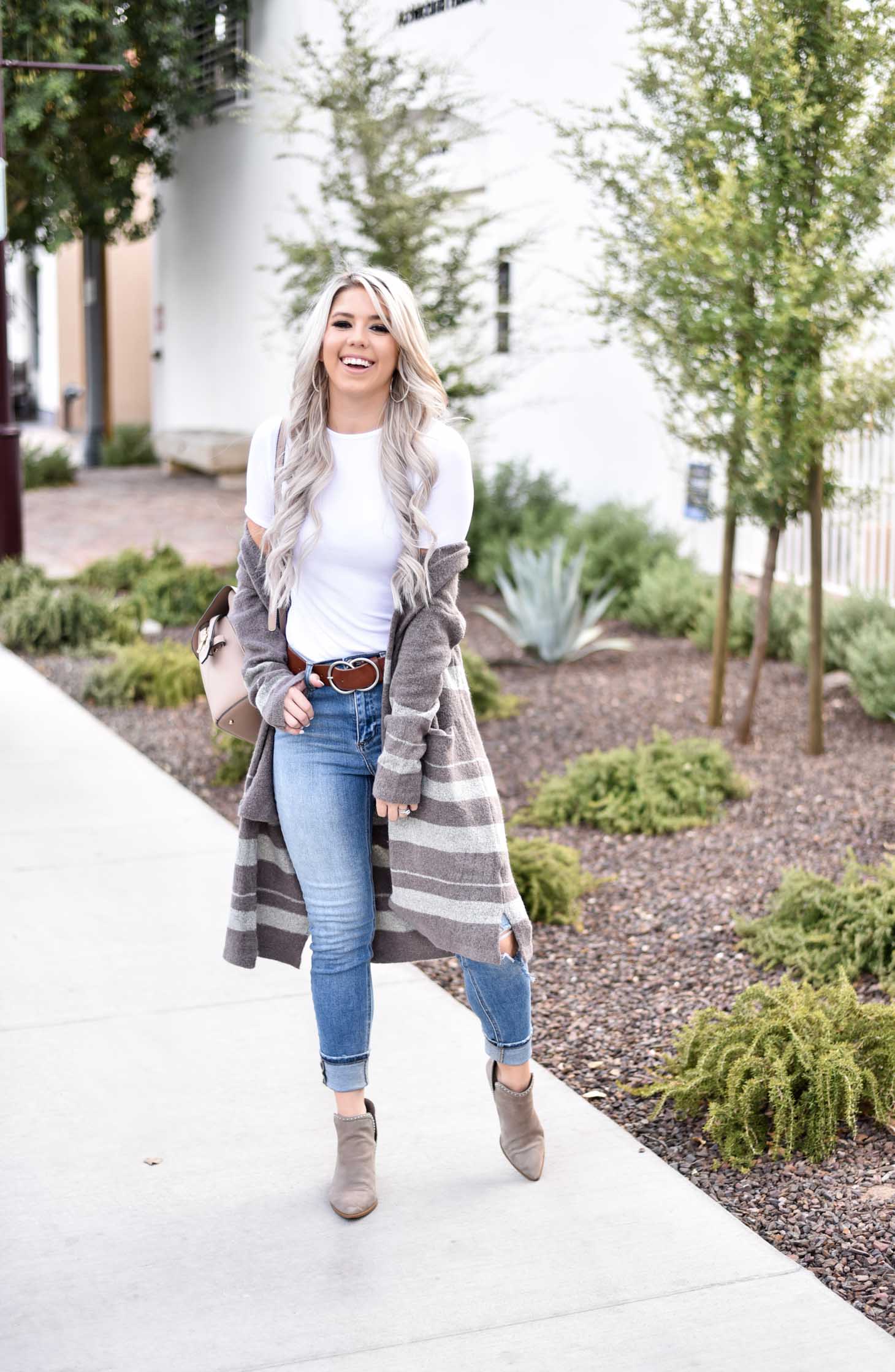 Erin Elizabeth of Wink and a Twirl share the cutest brown and white striped cardigan from Shop Sweet Olive perfect for layering this fall