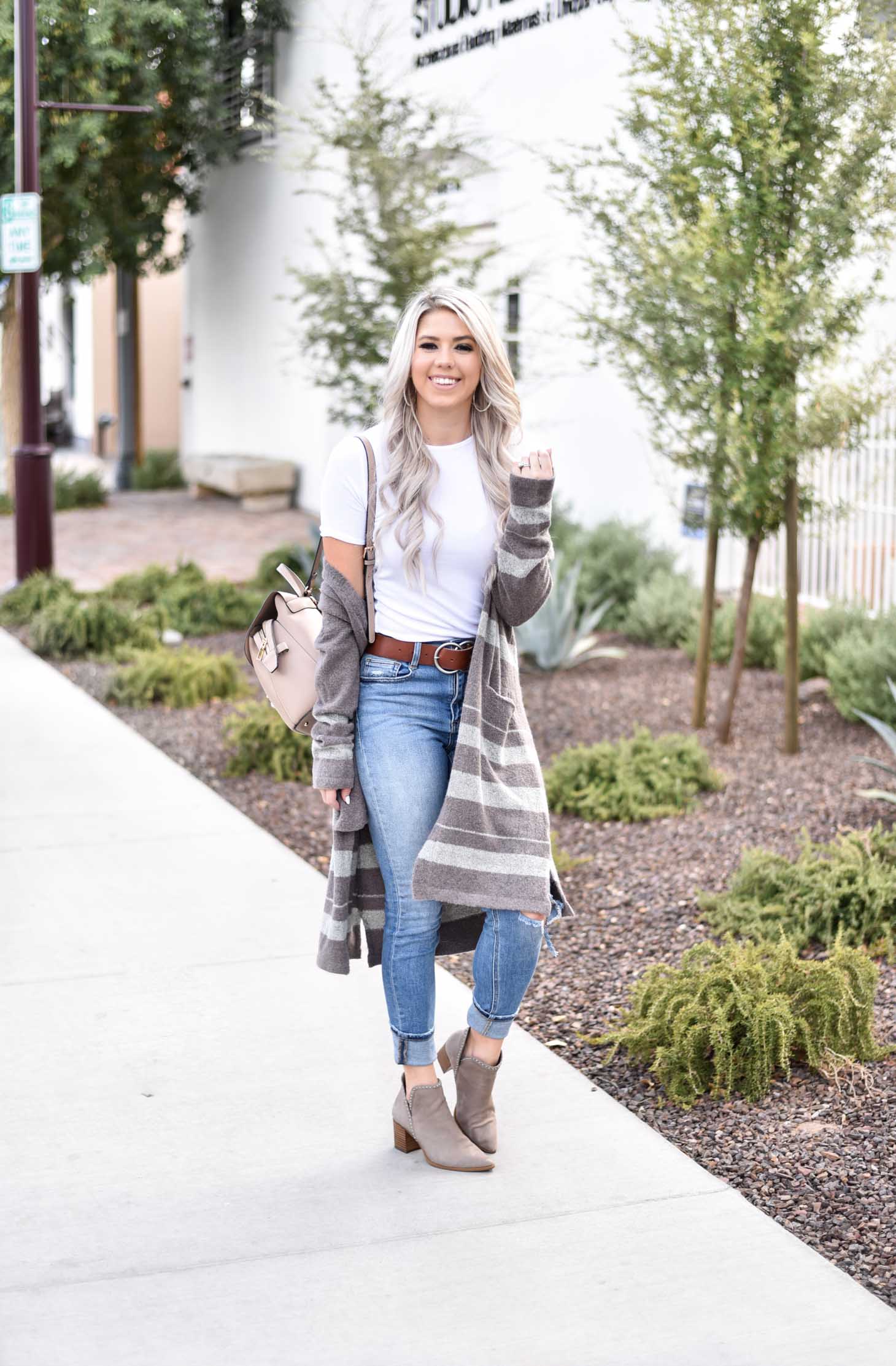 Erin Elizabeth of Wink and a Twirl share the cutest brown and white striped cardigan from Shop Sweet Olive perfect for layering this fall
