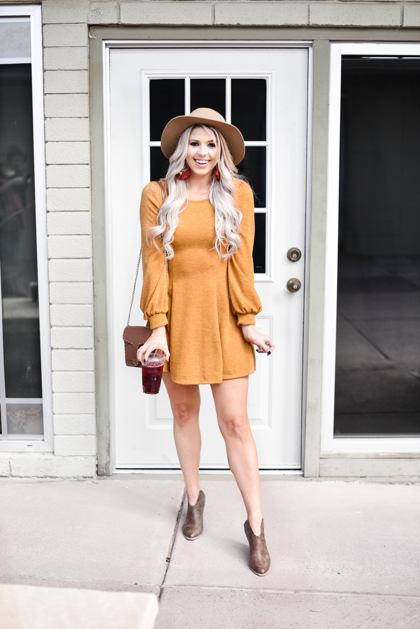 Erin Elizabeth of Wink and a Twirl shares the cutest fall sweater dress from Pink Lily Boutique 