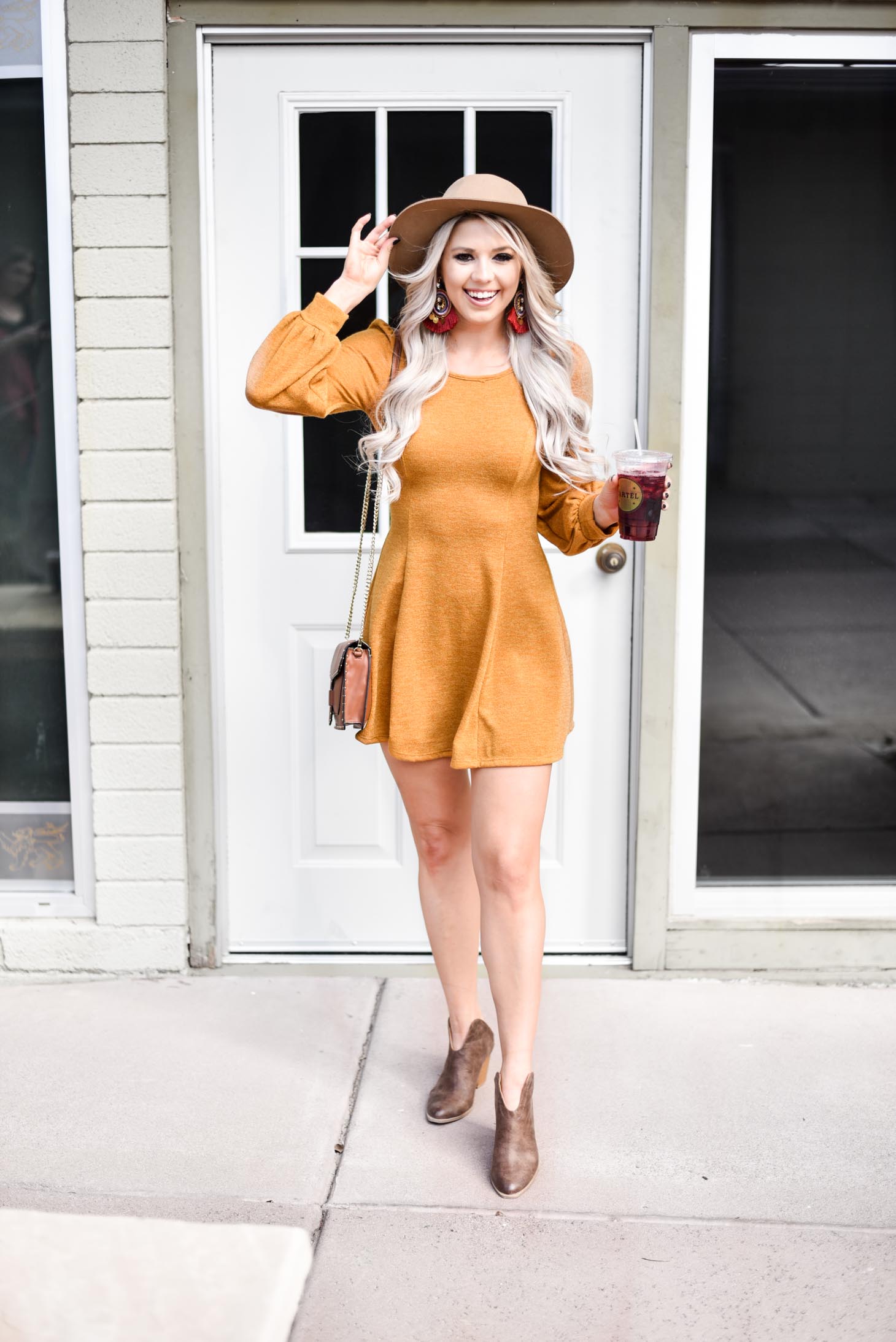 Erin Elizabeth of Wink and a Twirl shares the cutest fall sweater dress from Pink Lily Boutique 