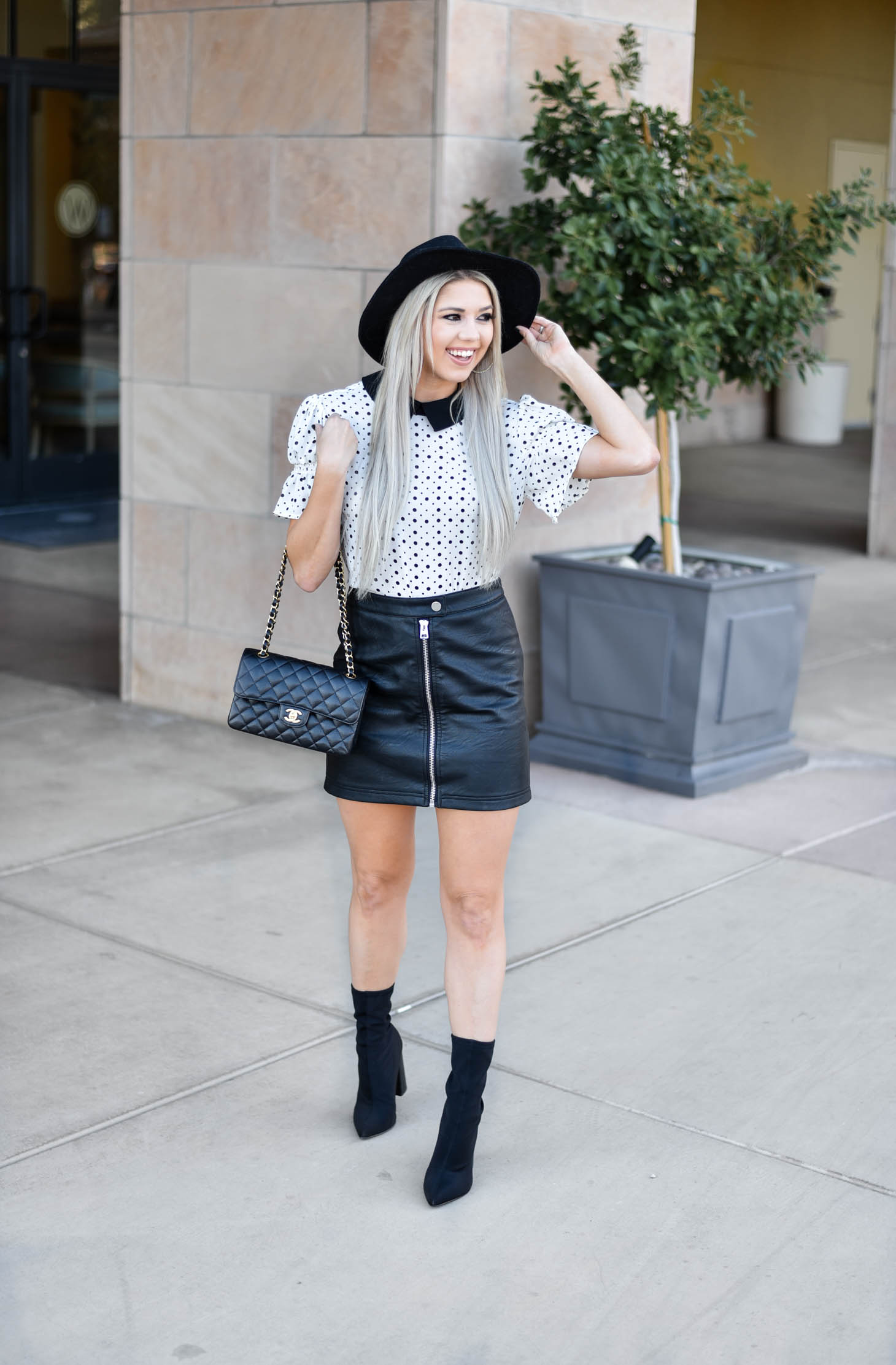 Erin Elizabeth of Wink and a Twirl shares the cutest CeCe Sportswear polka dot top and leather mini 