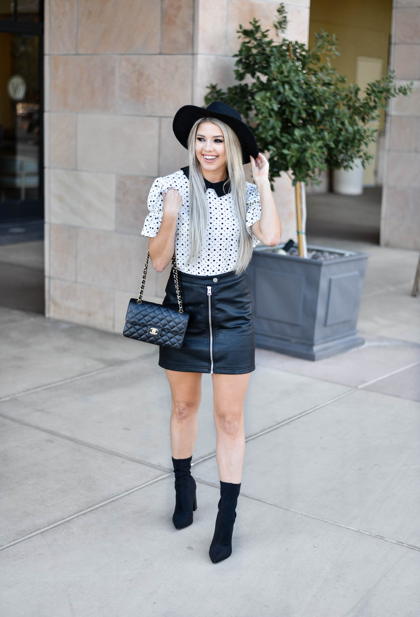 Erin Elizabeth of Wink and a Twirl shares the cutest CeCe Sportswear polka dot top and leather mini 