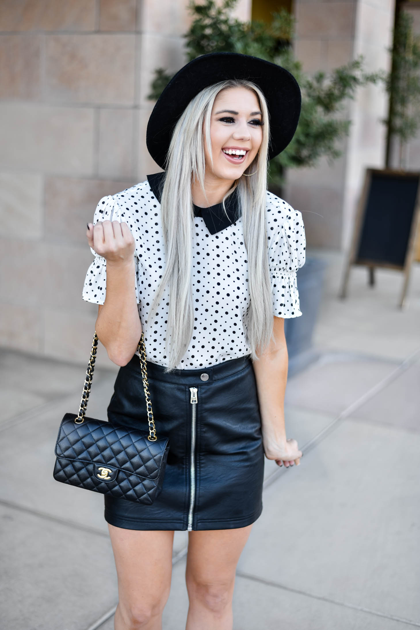 Erin Elizabeth of Wink and a Twirl shares the cutest CeCe Sportswear polka dot top and leather mini 