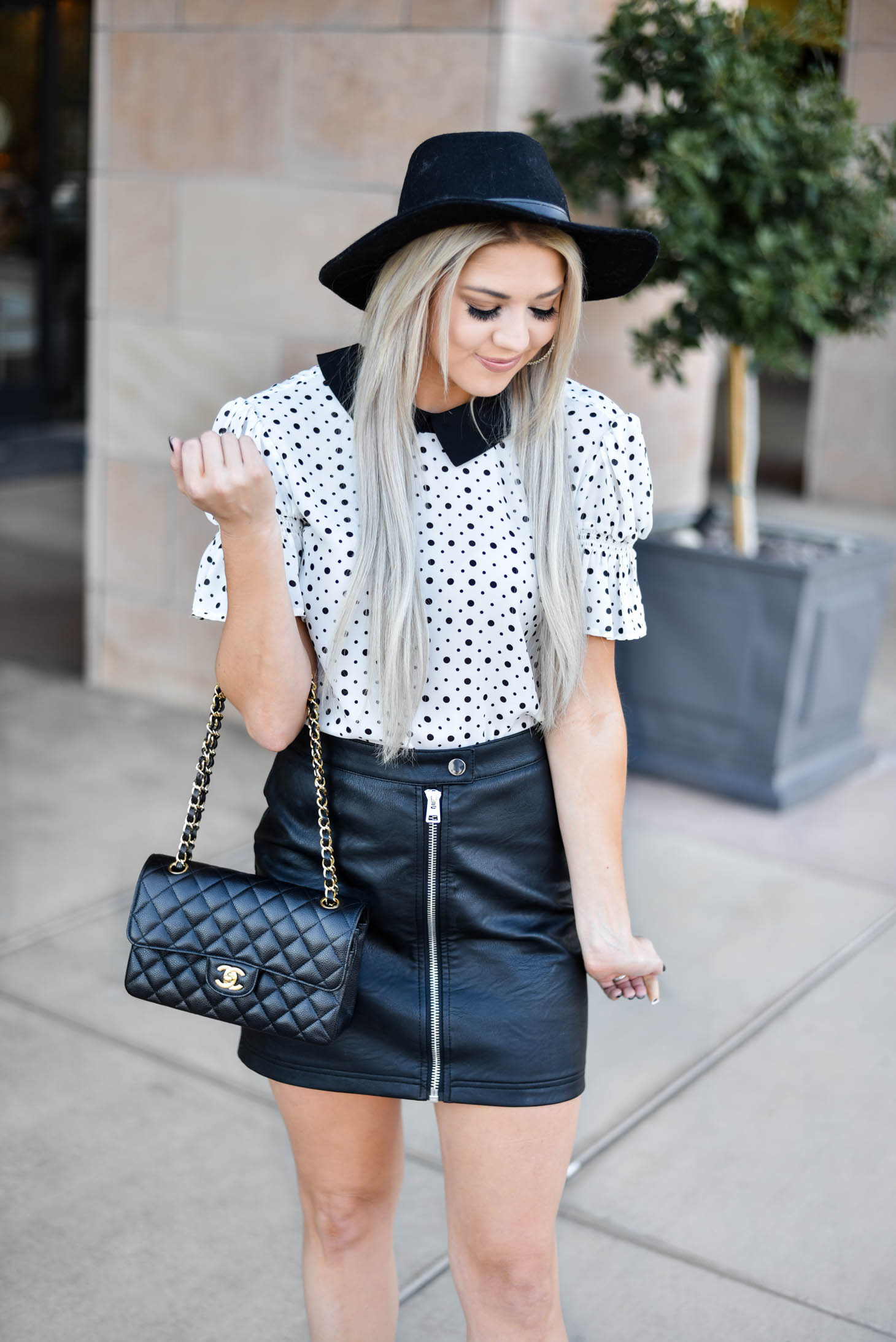 Erin Elizabeth of Wink and a Twirl shares the cutest CeCe Sportswear polka dot top and leather mini 