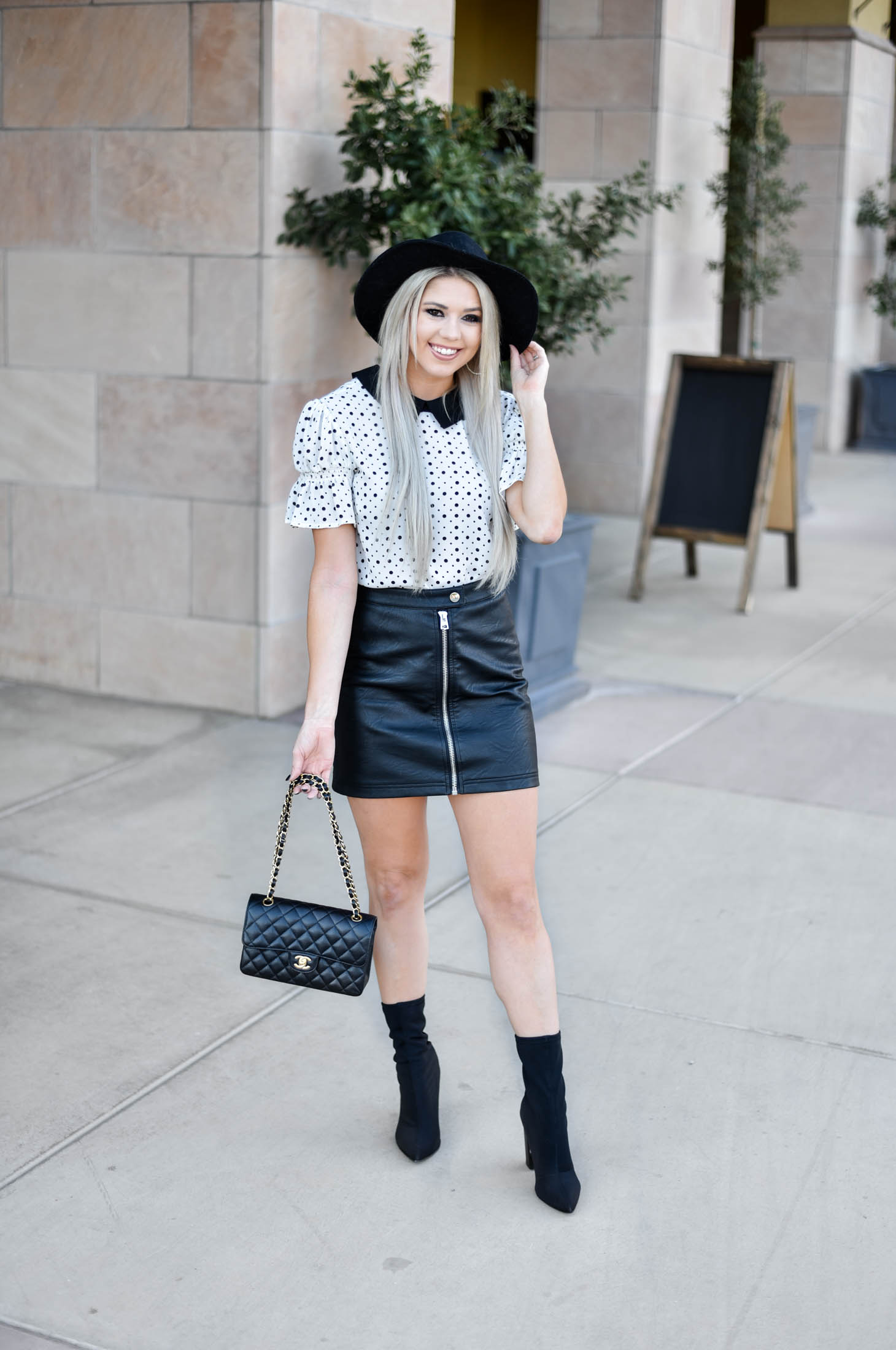 Erin Elizabeth of Wink and a Twirl shares the cutest CeCe Sportswear polka dot top and leather mini 
