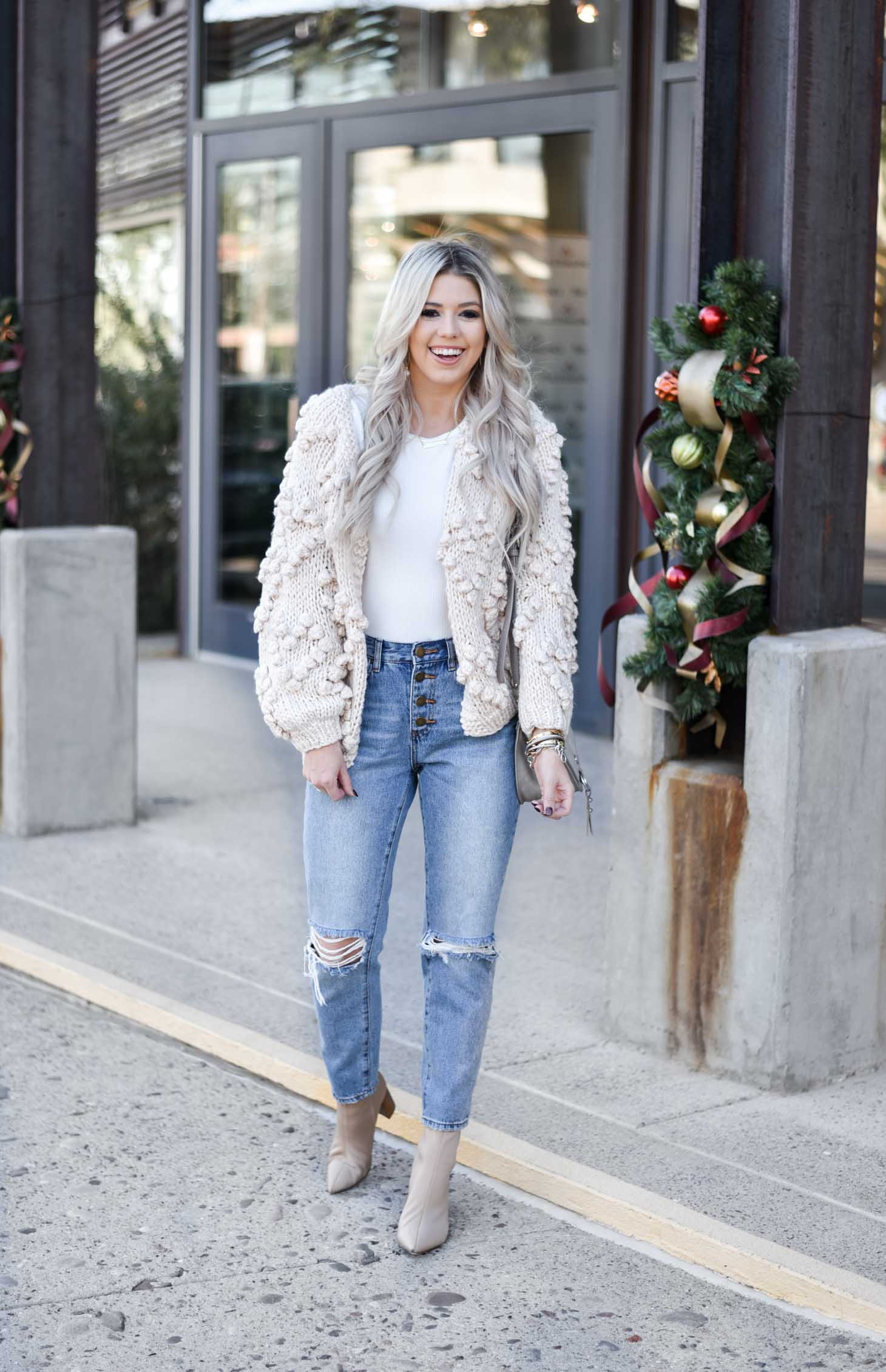 Erin Elizabeth of Wink and a Twirl shares the must have winter chunky cardigan from Chicwish