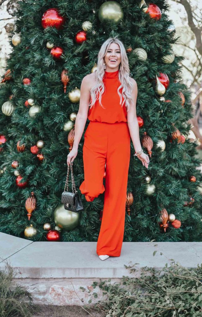 Erin Elizabeth of Wink and a Twirl share the perfect red jumpsuit from Lulus for any night out on the town