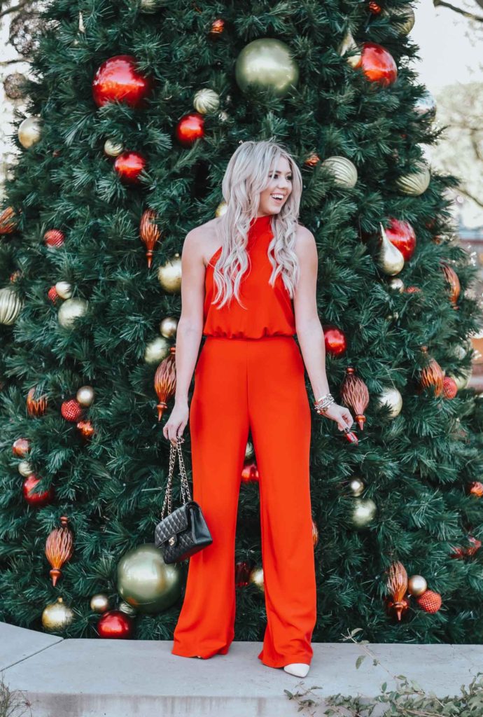 Erin Elizabeth of Wink and a Twirl share the perfect red jumpsuit from Lulus for any night out on the town