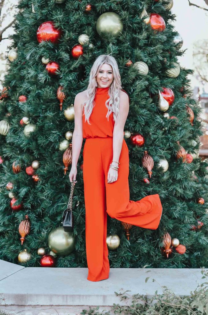 Erin Elizabeth of Wink and a Twirl share the perfect red jumpsuit from Lulus for any night out on the town