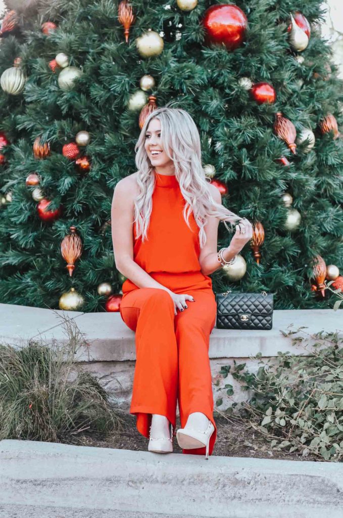 Erin Elizabeth of Wink and a Twirl share the perfect red jumpsuit from Lulus for any night out on the town