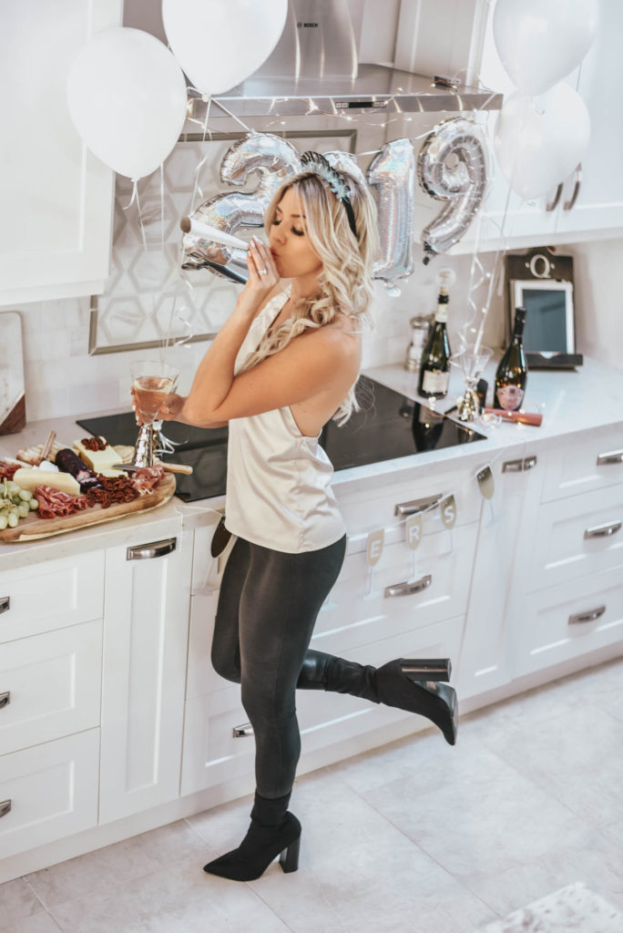 Erin Elizabeth of Wink and a Twirl shares the perfect party top and leggings for New Years Eve