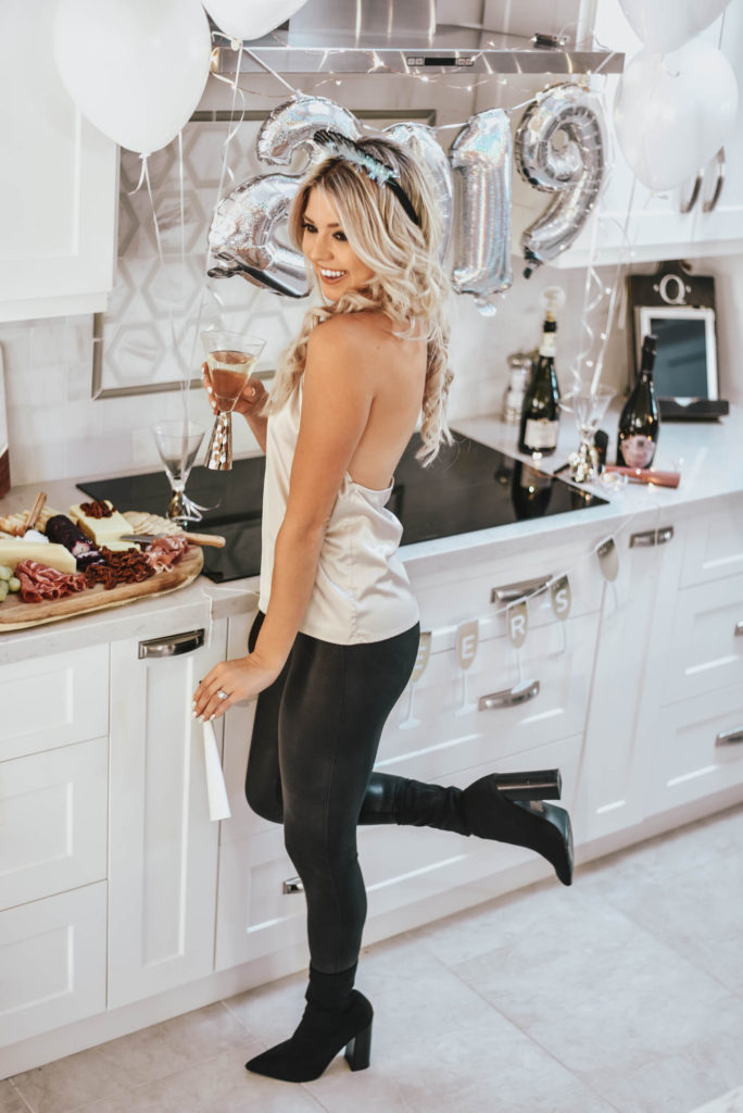 Erin Elizabeth of Wink and a Twirl shares the perfect party top and leggings for New Years Eve
