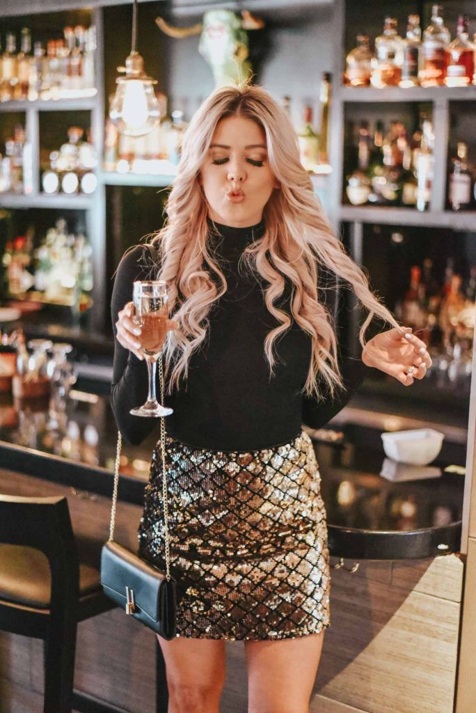 Erin Elizabeth of Wink and a Twirl shares her go to New Years Eve look from Red Dress Boutique, as well as other New Years Eve Looks
