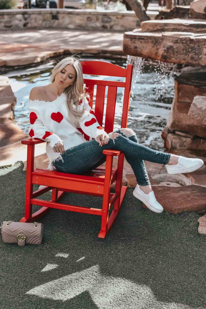 Erin Elizabeth of Wink and a Twirl shares the cutest heart sweater for Valentine's Day from Magnolia Boutique 