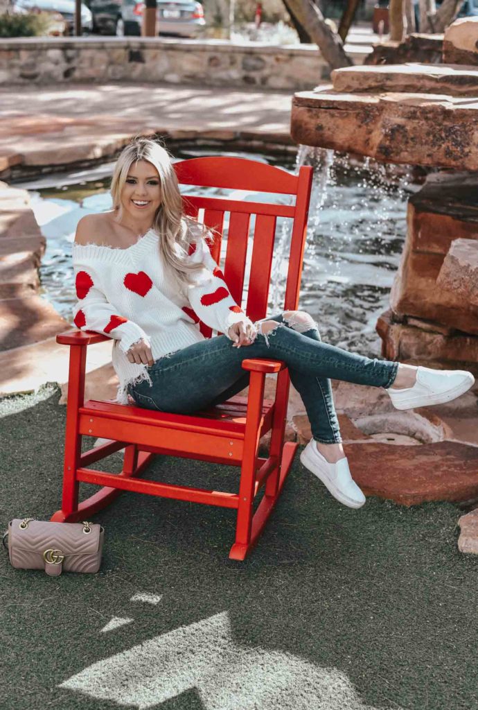 Erin Elizabeth of Wink and a Twirl shares the cutest heart sweater for Valentine's Day from Magnolia Boutique 