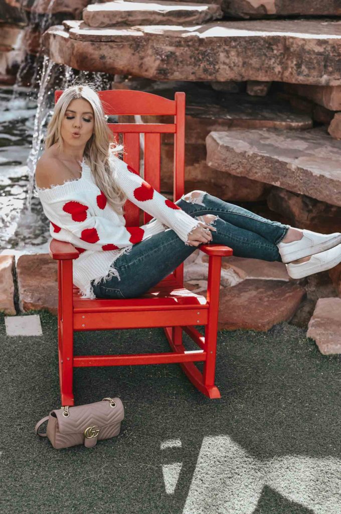 Erin Elizabeth of Wink and a Twirl shares the cutest heart sweater for Valentine's Day from Magnolia Boutique 