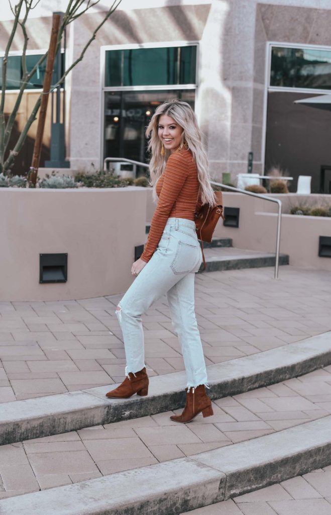 Erin Elizabeth of Wink and a Twirl shares the perfect casual look from Lulus - A pair of light high waist jeans and a striped bodysuit