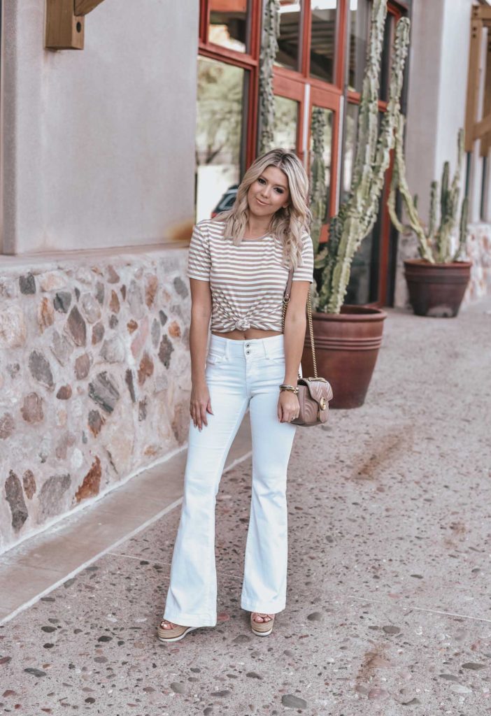 Erin Elizabeth of Wink and a Twirl shares the perfect pair of white flared jeans and neutral striped tee!